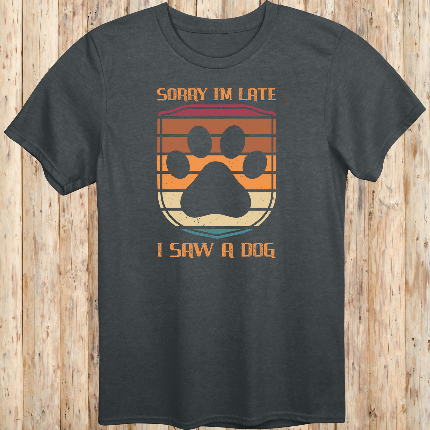 Dark heather unisex t-shirt with retro-colored paw print shield and the phrase 'Sorry I’m Late, I Saw a Dog', perfect for dog lovers