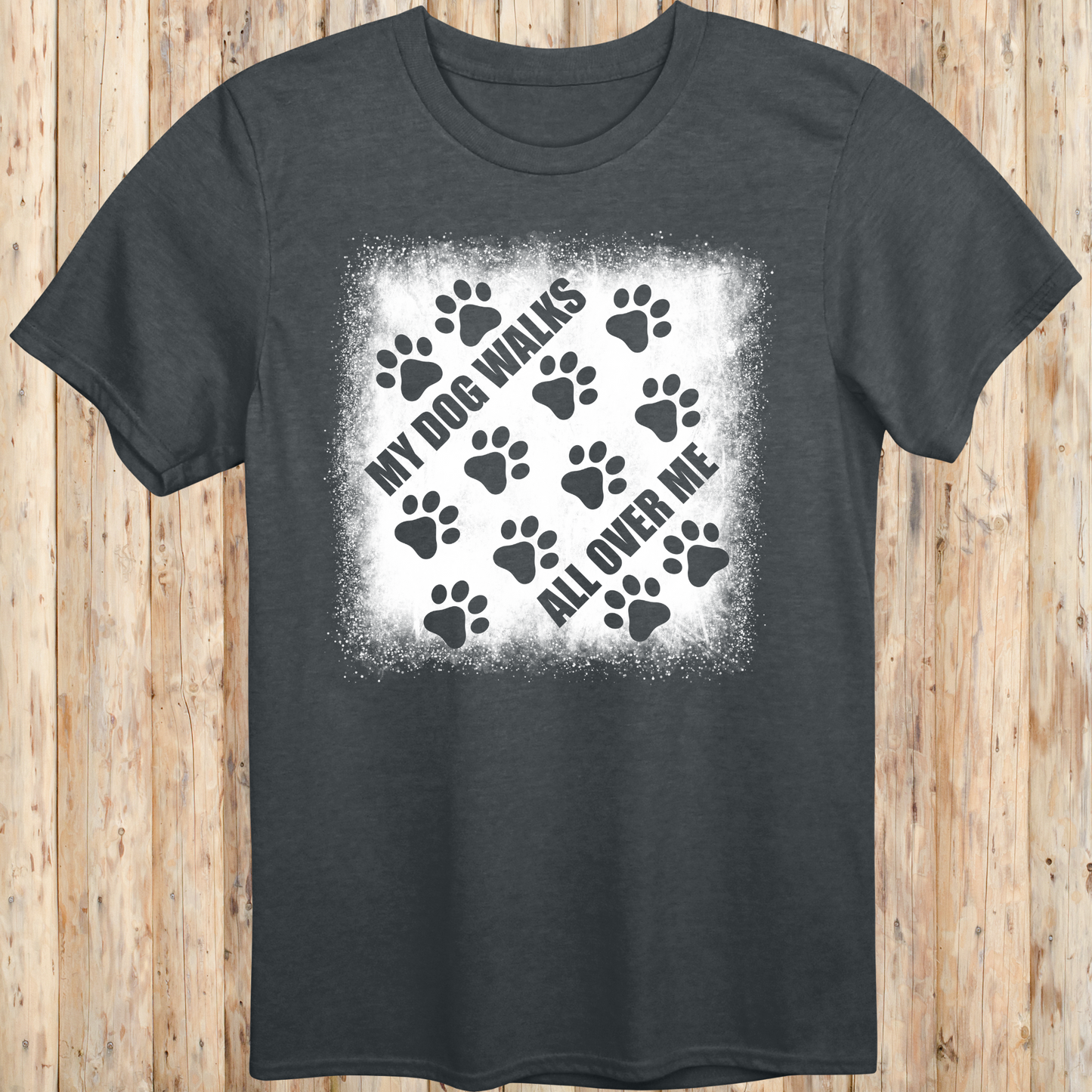 Dark heather unisex t-shirt with paw prints and the phrase 'My Dog Walks All Over Me' printed on the front for men women adults and humans.