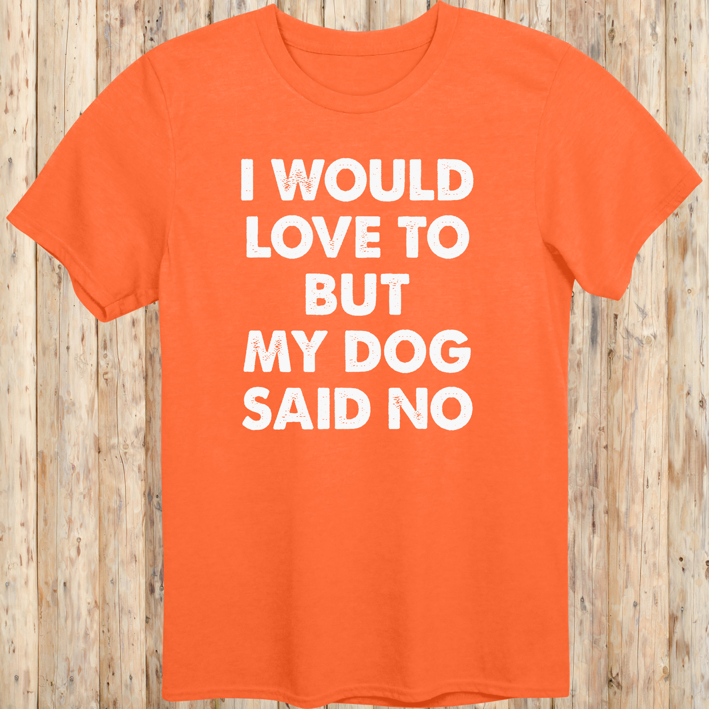 Orange unisex t-shirt with white text that reads 'I Would Love To But My Dog Said No', perfect for dog lovers and pet parents