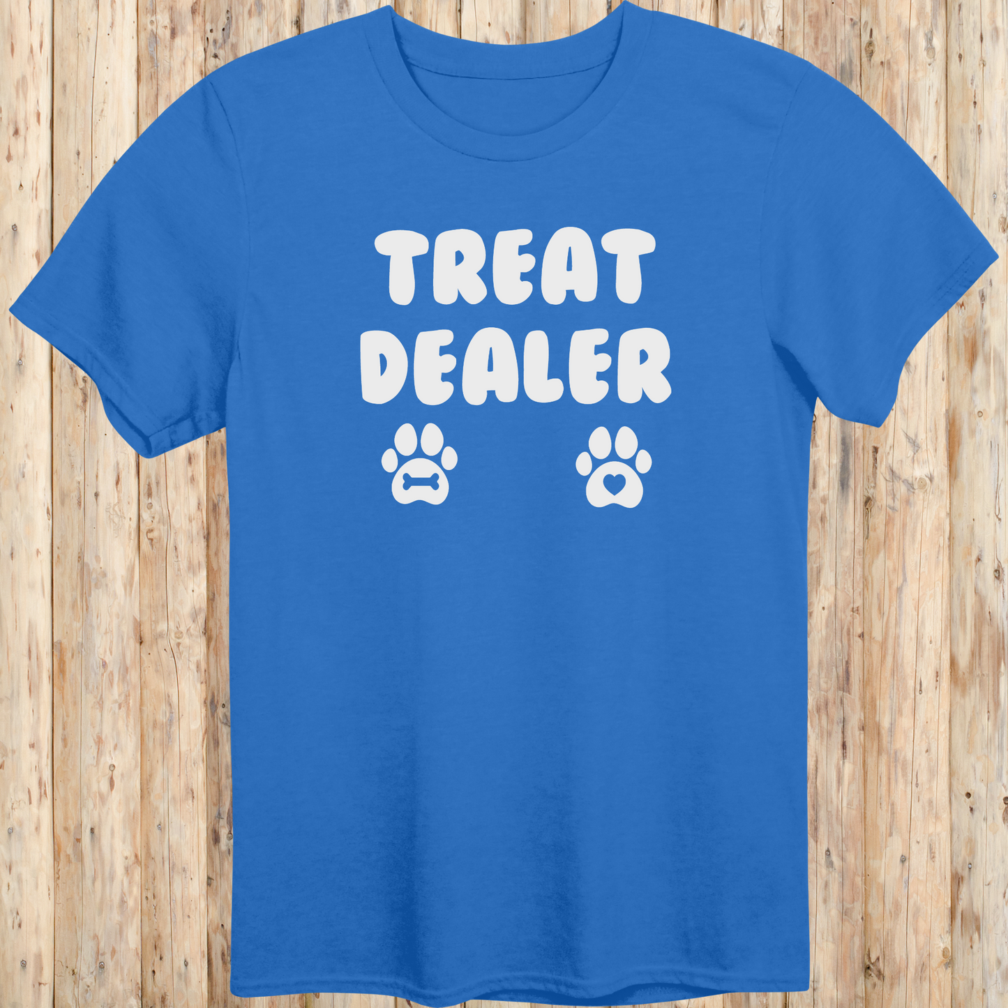 Royal blue unisex t-shirt for men and women says Treat Dealer and has 2 paw prints.