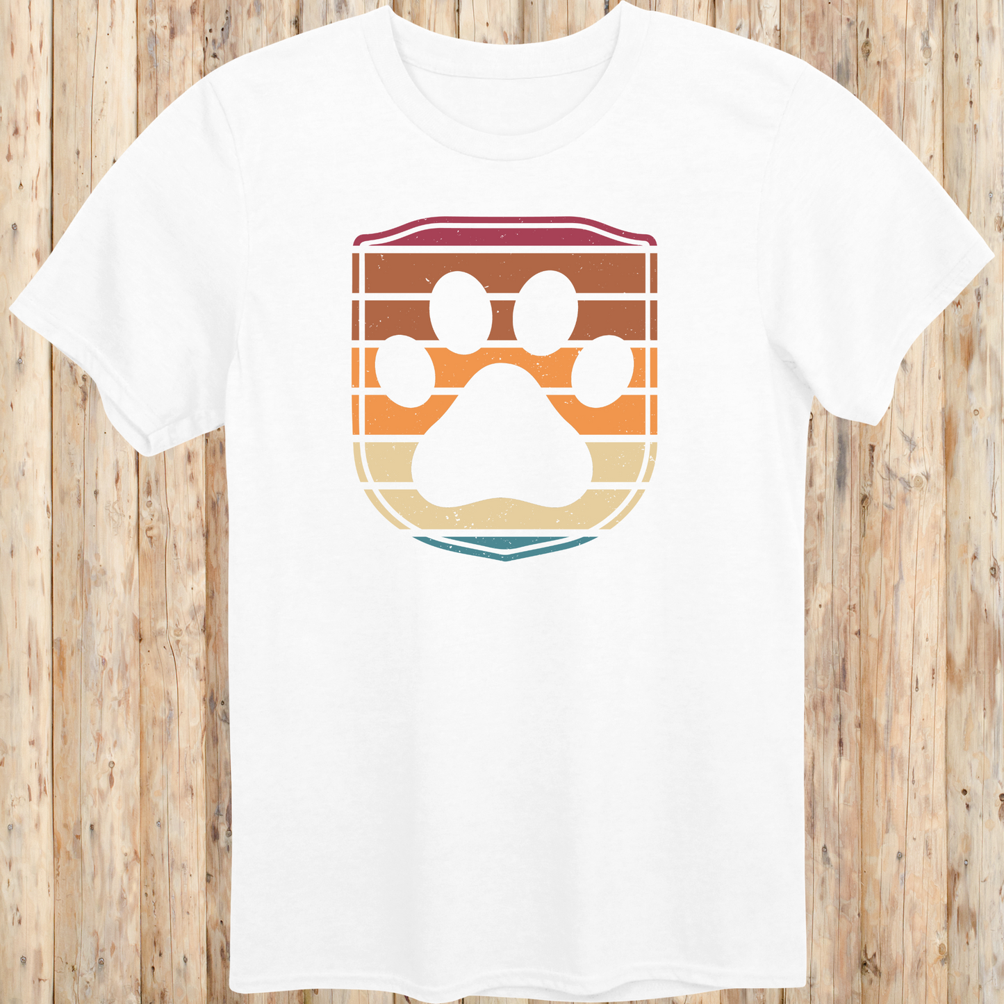 Unisex white t-shirt featuring a retro-style dog paw print inside a colorful shield graphic, designed for dog lovers