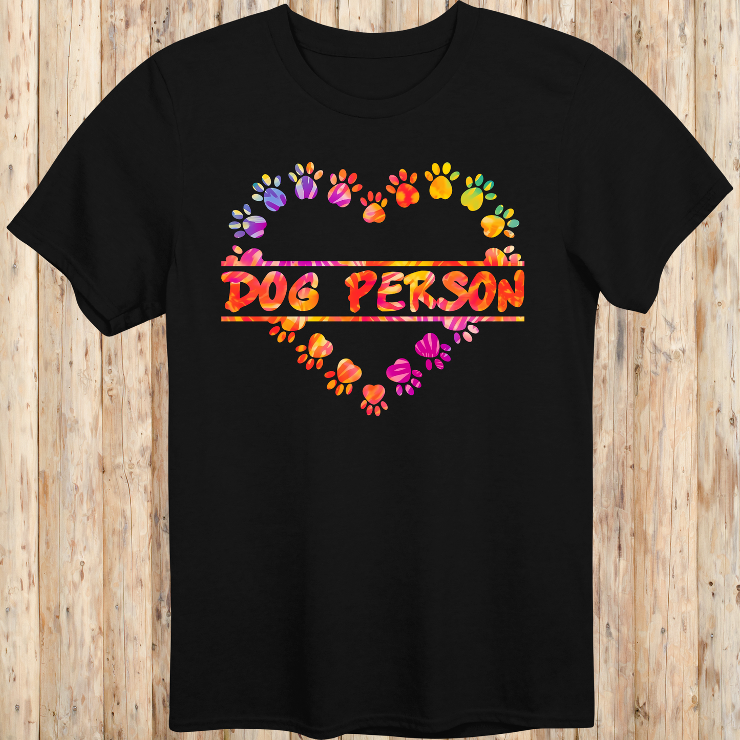 Black unisex t-shirt with the words 'Dog Person' and a colorful heart-shaped paw print design, perfect for dog lovers and pet parents
