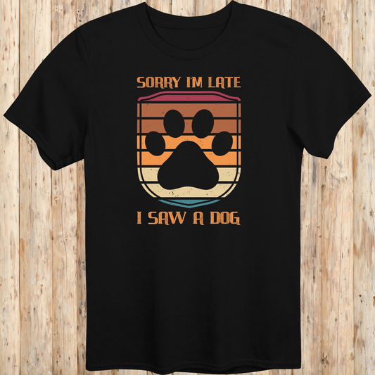 Black unisex t-shirt with retro-colored paw print shield and the phrase 'Sorry I’m Late, I Saw a Dog', perfect for dog lovers