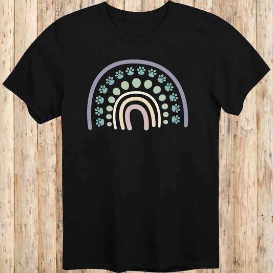 Black unisex t-shirt with a colorful boho rainbow and white dog paw print design, ideal for dog lovers and pet parents with a boho style