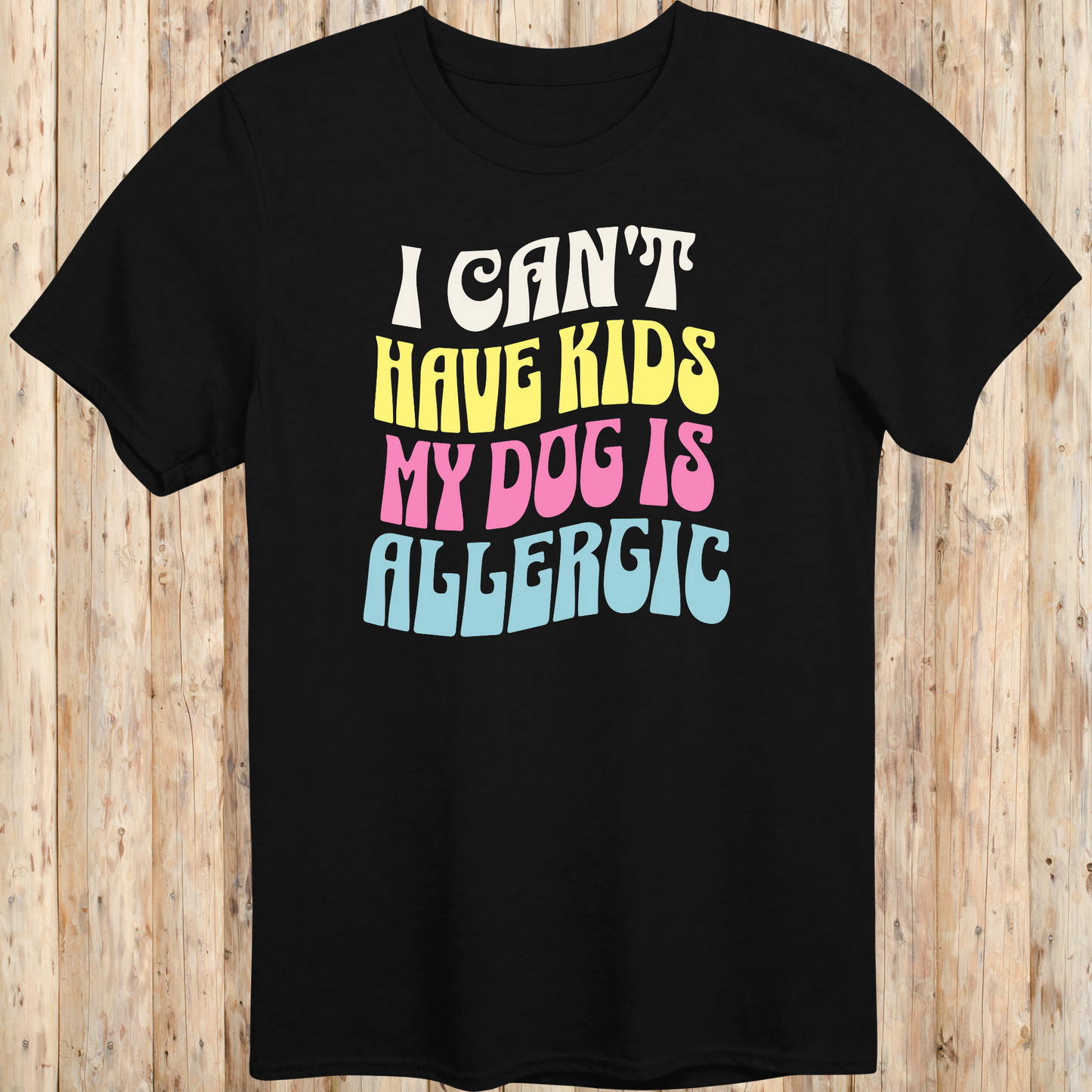 Black unisex t-shirt with white text that says 'I Can’t Have Kids, My Dog Is Allergic', designed for dog lovers with a funny side