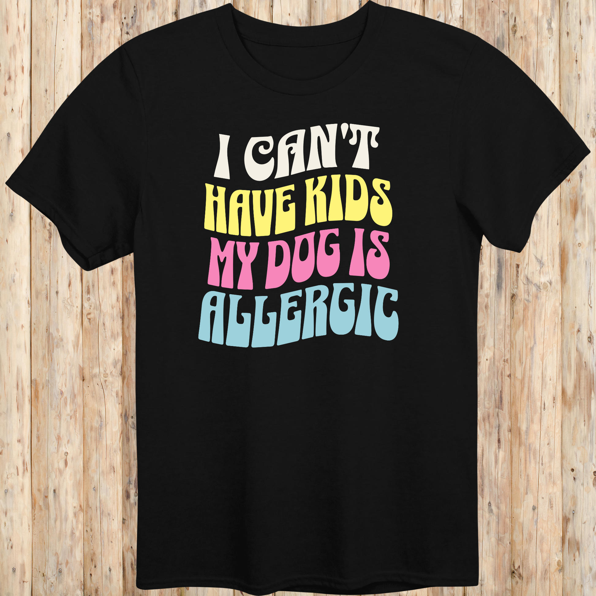 Black unisex t-shirt with white text that says 'I Can’t Have Kids, My Dog Is Allergic', designed for dog lovers with a funny side