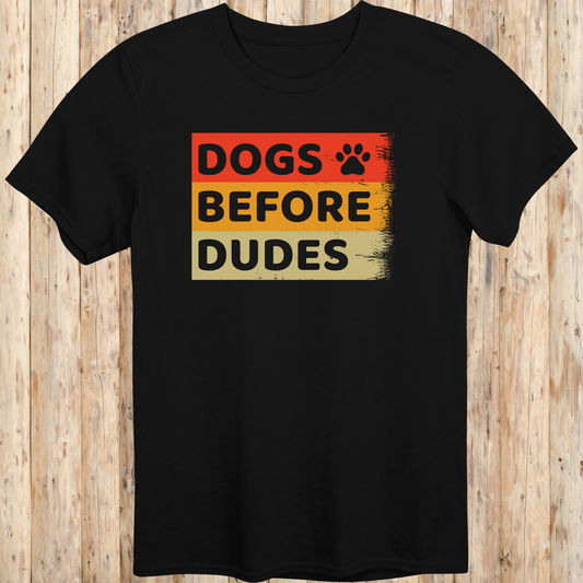 Black unisex t-shirt with text that says 'Dogs Before Dudes', perfect for dog moms and dog-loving women with a sense of humor