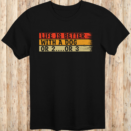 Black unisex t-shirt with text that reads 'Life Is Better With a Dog… or 2 or 3', perfect for multi-dog owners and pet lovers
