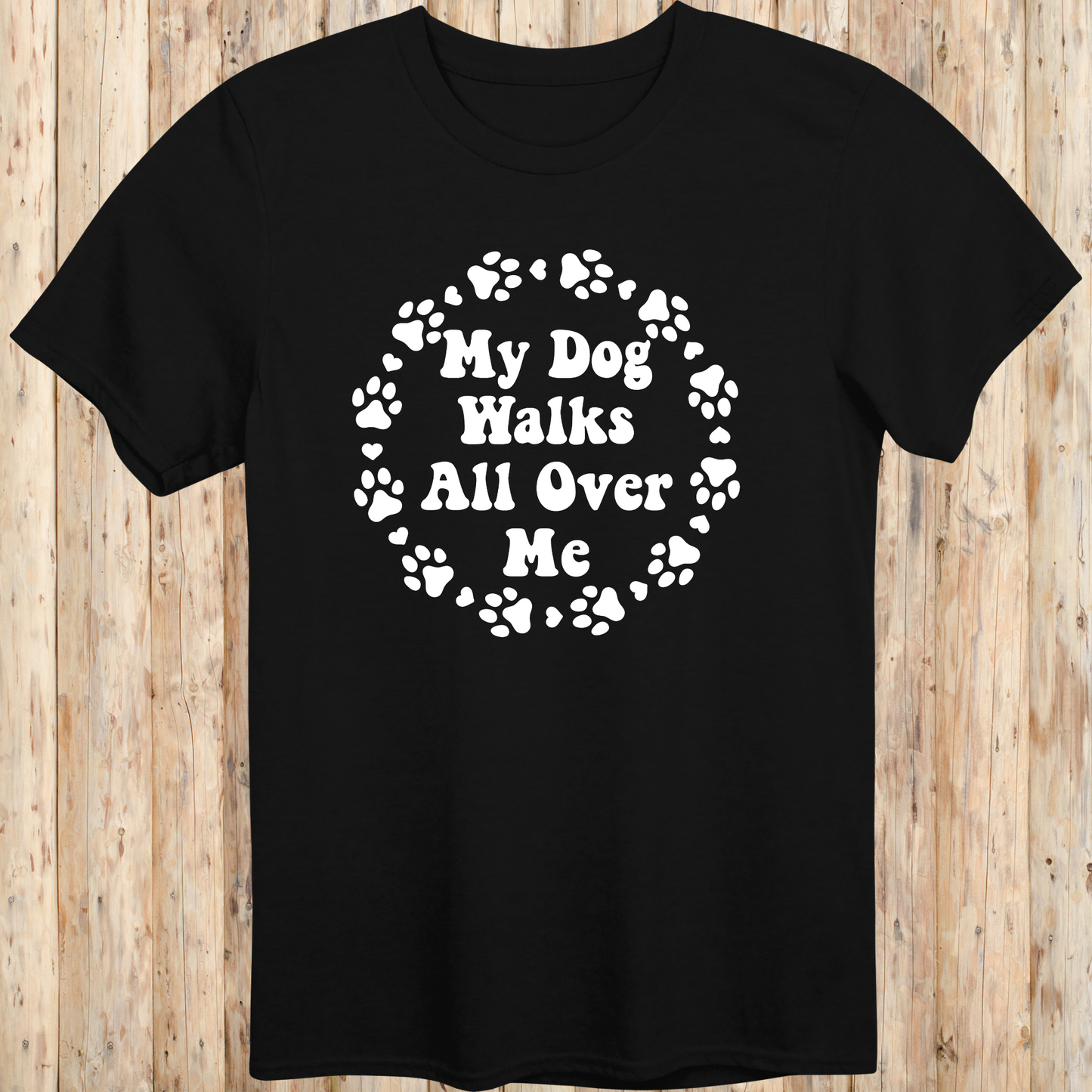 unisex black t-shirt for dog lovers says my dog walks all over me paw prints circle