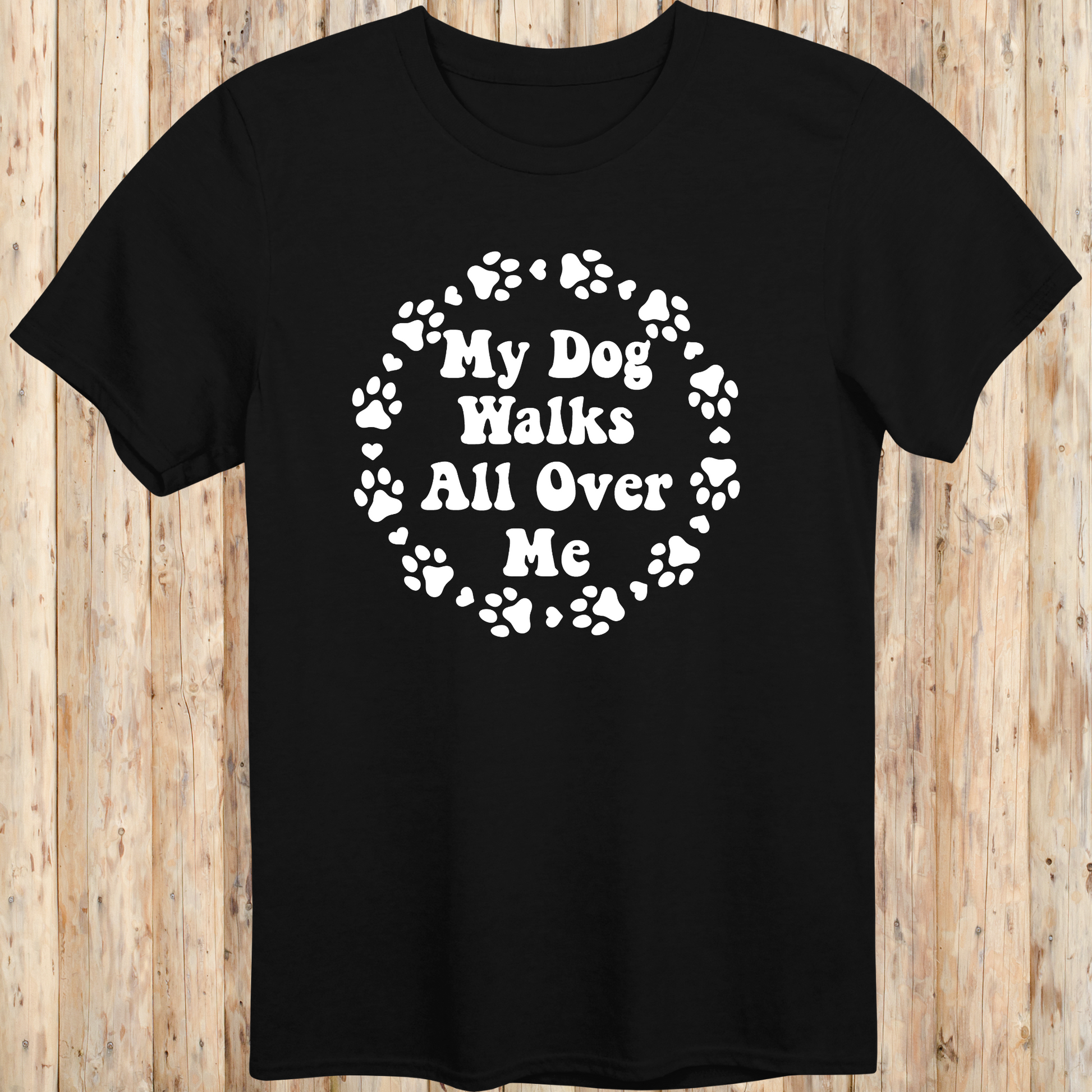 unisex black t-shirt for dog lovers says my dog walks all over me paw prints circle