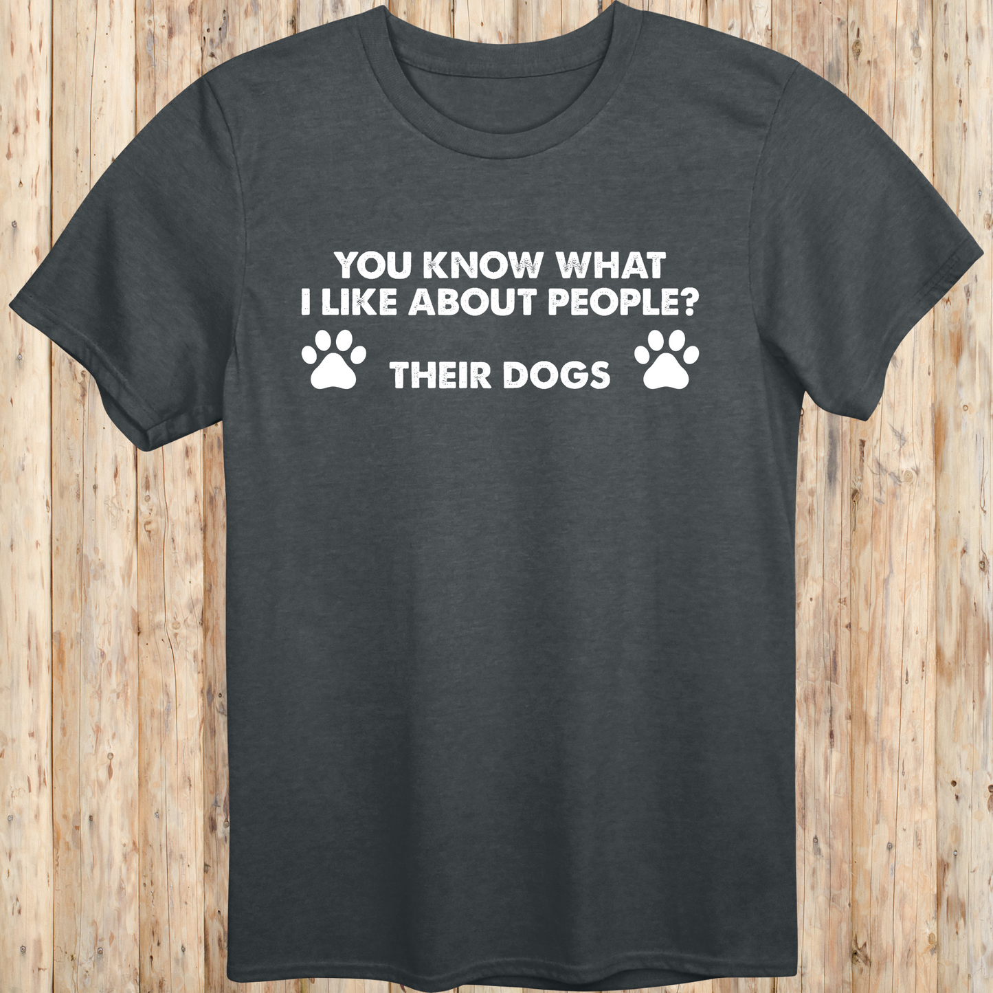 Dark heather unisex t-shirt with text that says 'You Know What I Like About People? Their Dogs', perfect for dog lovers with a sense of humor