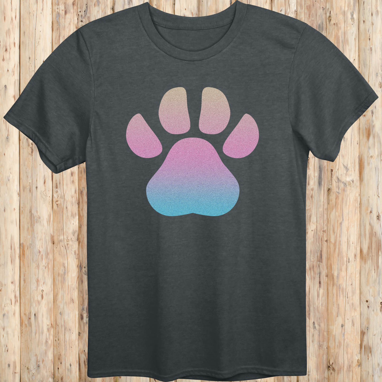 Dark heather unisex t-shirt with a large, colorful dog paw print design on the front, ideal for dog lovers and pet enthusiasts