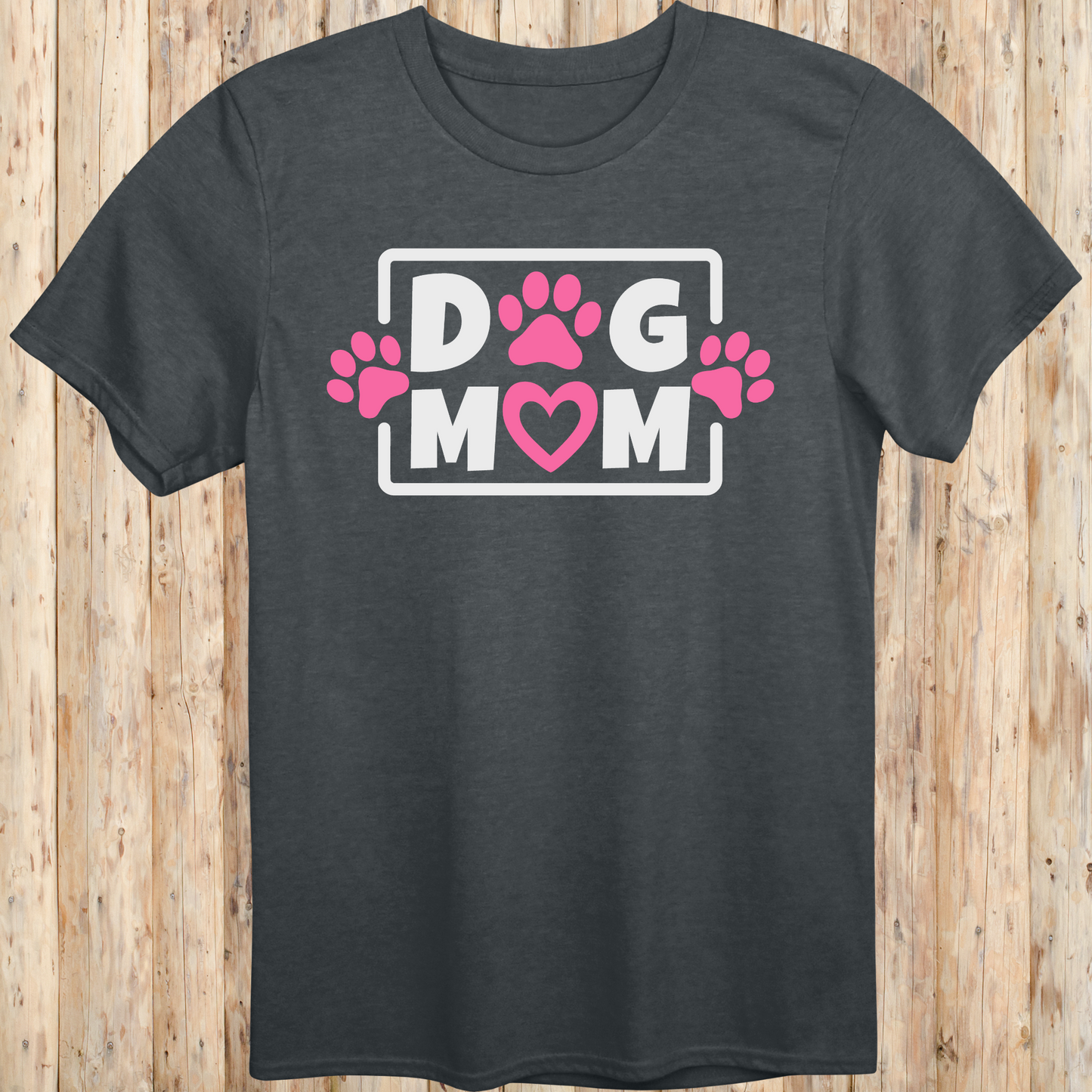 Dark heather unisex t-shirt with bold text that says 'Dog Mom', ideal for pet moms, dog lovers, and rescue advocates
