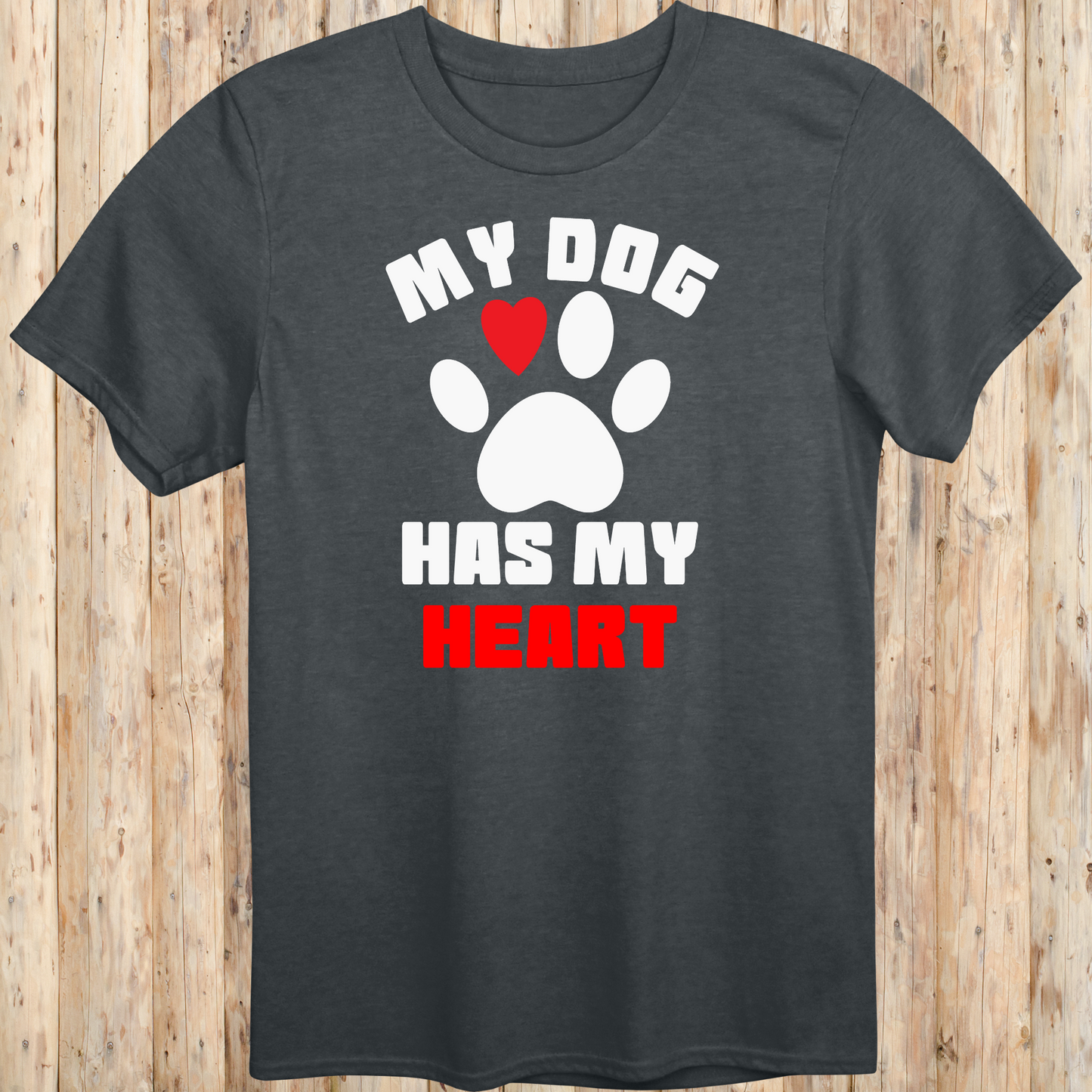 Dark heather unisex t-shirt with bold text that reads 'My Dog Has My Heart', perfect for dog lovers and devoted pet parents