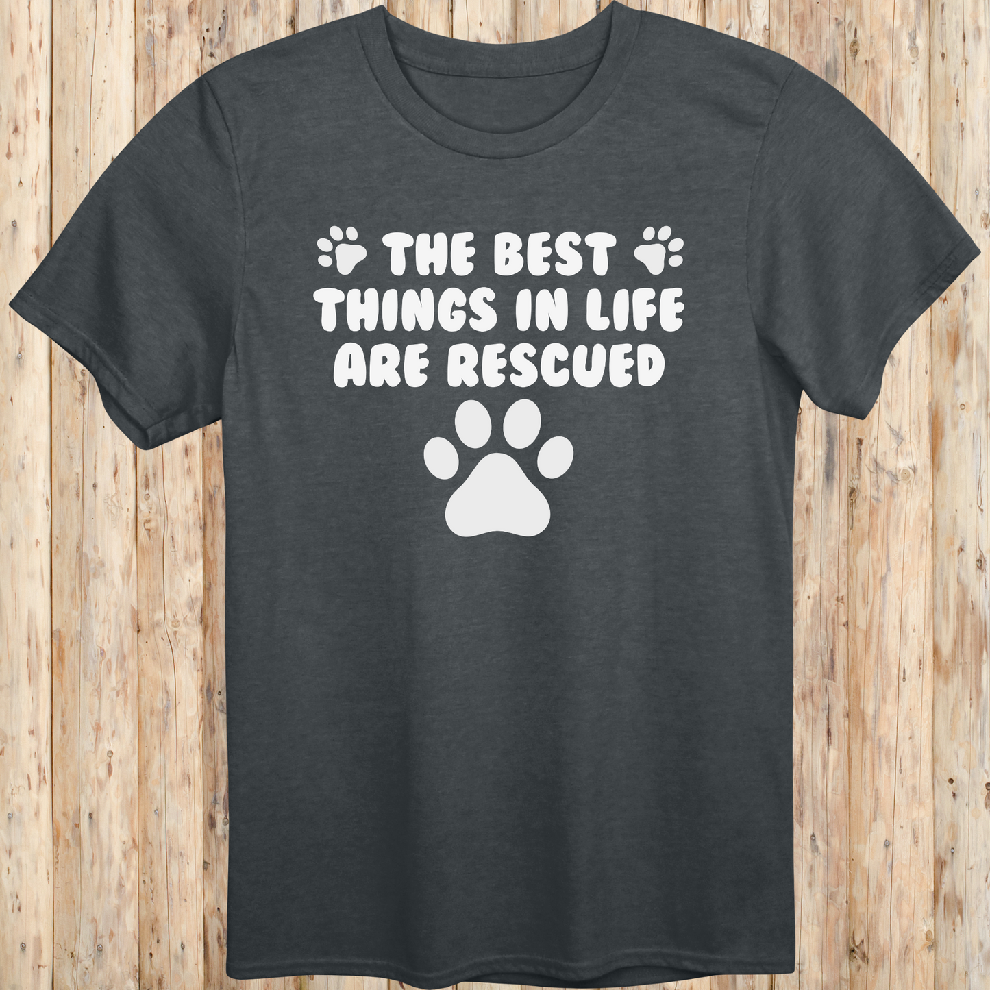 Dark heather unisex t-shirt with text that reads 'The Best Things in Life Are Rescued', ideal for rescue dog owners and pet adopters