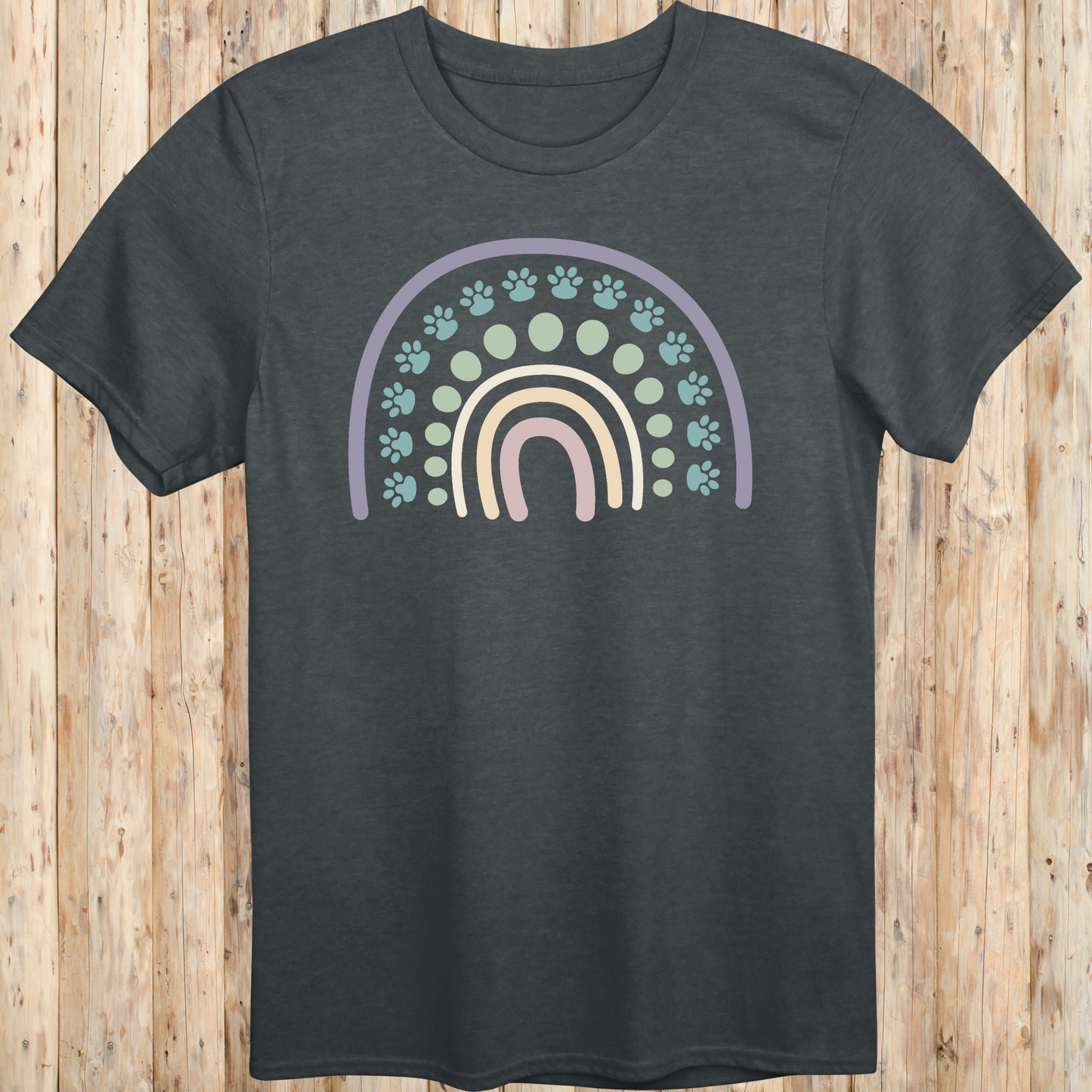 Dark heather unisex t-shirt with a colorful boho rainbow and white dog paw print design, ideal for dog lovers and pet parents with a boho style