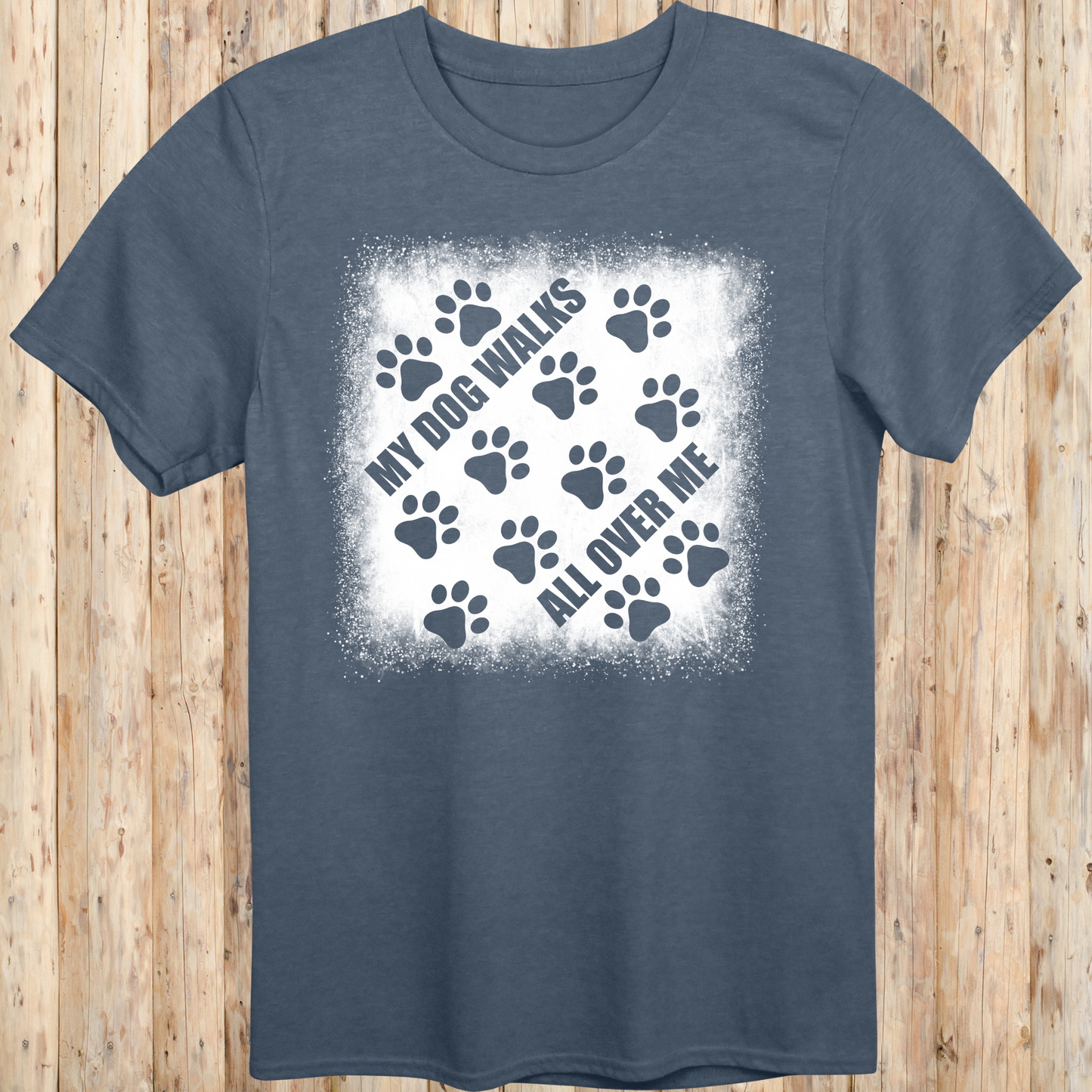 Heather indigo unisex t-shirt with paw prints and the phrase 'My Dog Walks All Over Me' printed on the front for men women adults and humans.