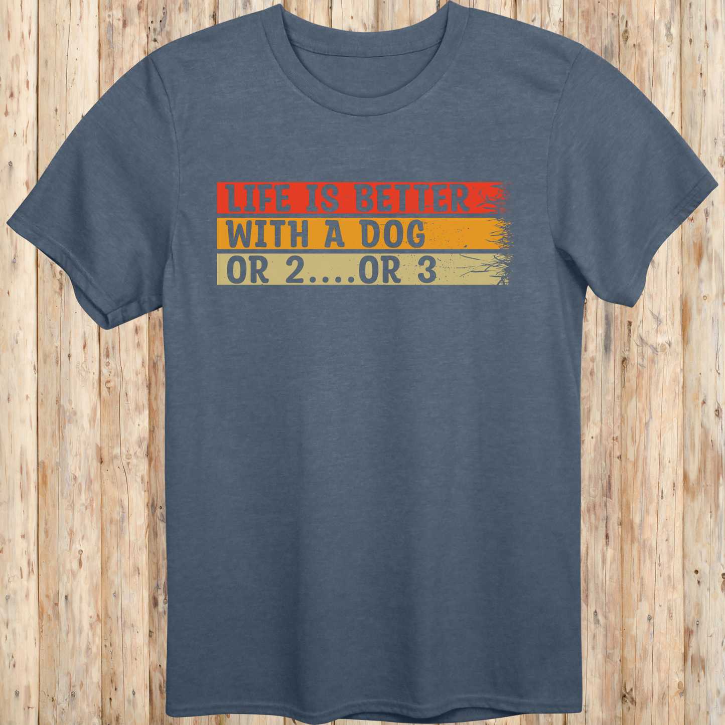 Heather indigo unisex t-shirt with text that reads 'Life Is Better With a Dog… or 2 or 3', perfect for multi-dog owners and pet lovers