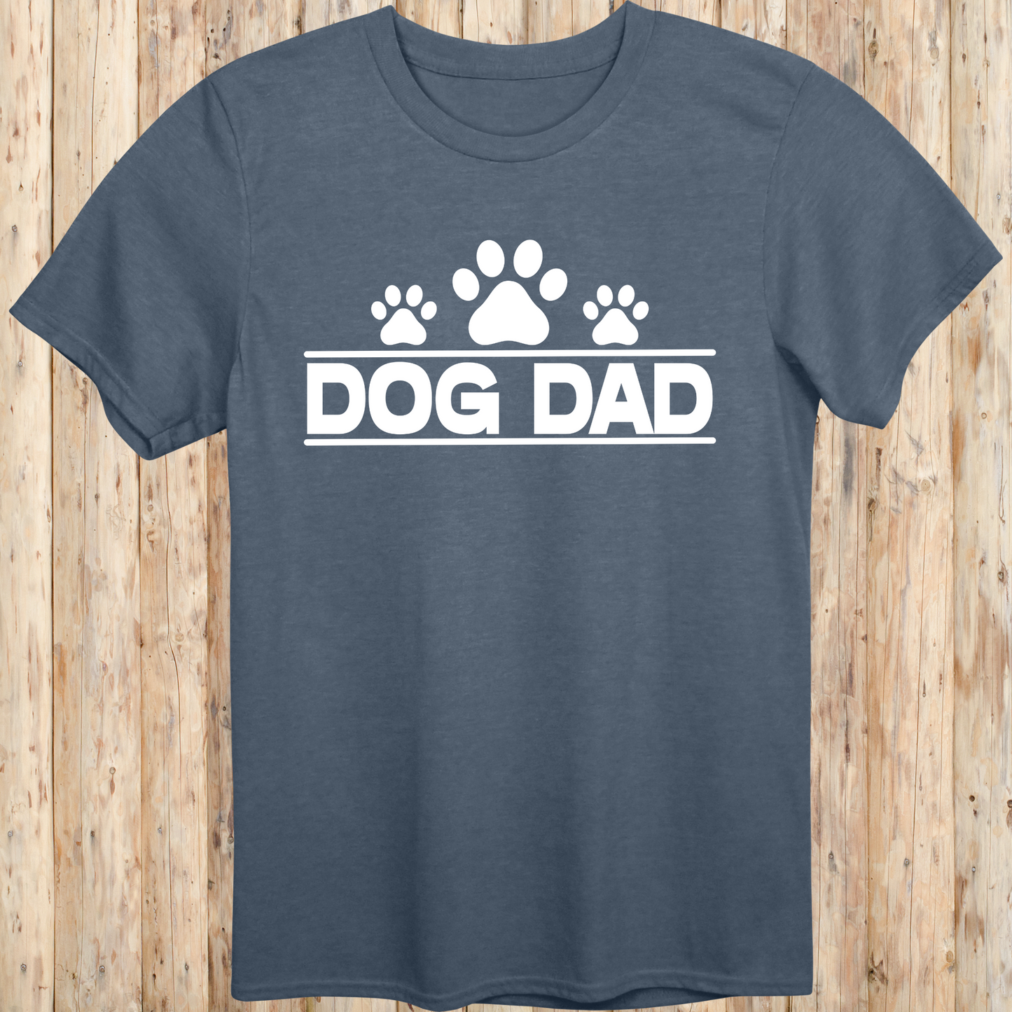 Heather indigo unisex t-shirt with bold text that says 'Dog Dad', perfect for fathers, pet owners, and dog lovers
