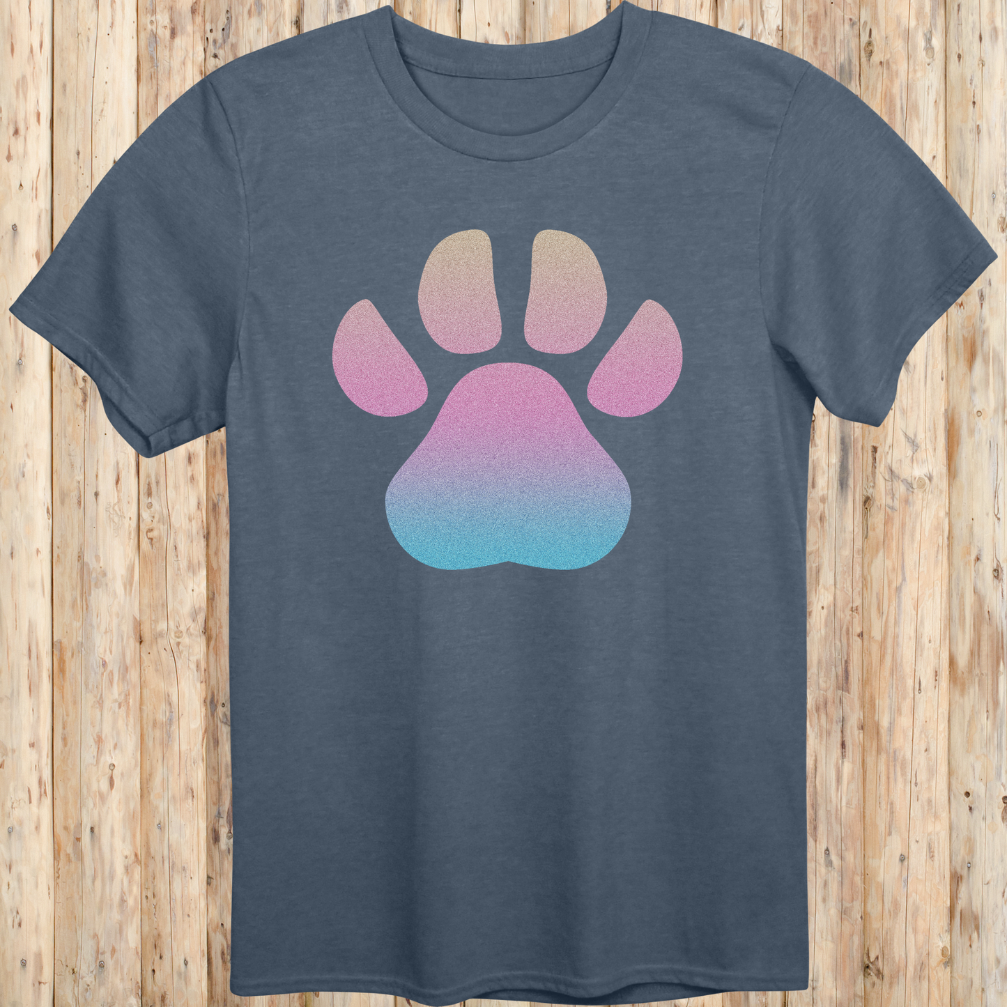 Heather indigo unisex t-shirt with a large, colorful dog paw print design on the front, ideal for dog lovers and pet enthusiasts