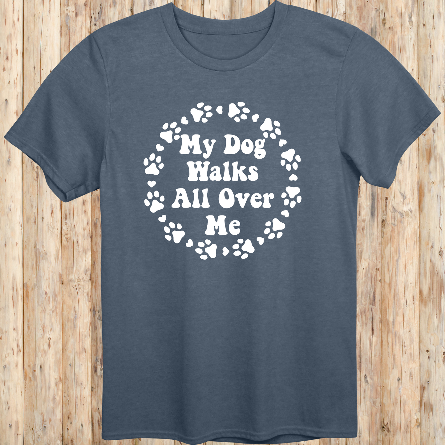 unisex heather indigo t-shirt for dog lovers says my dog walks all over me paw prints circle