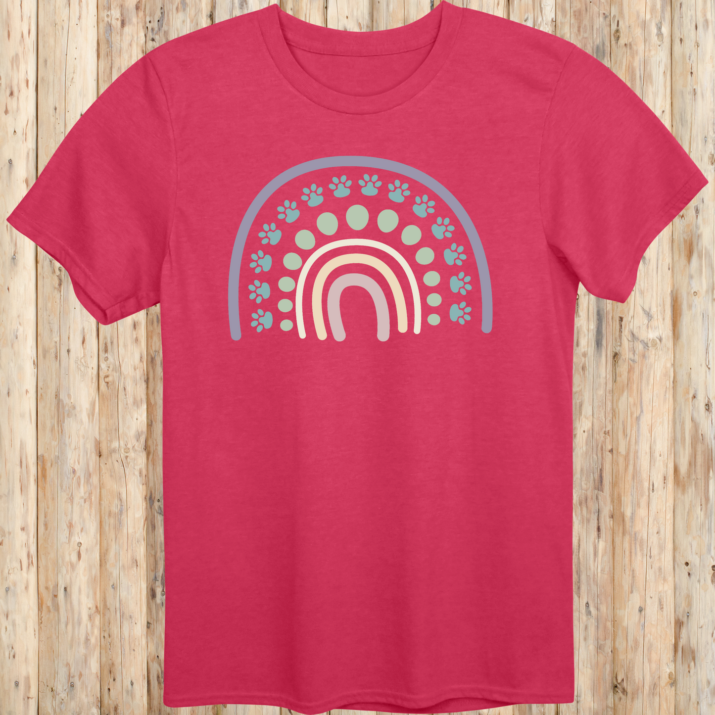 Heather red unisex t-shirt with a colorful boho rainbow and white dog paw print design, ideal for dog lovers and pet parents with a boho style