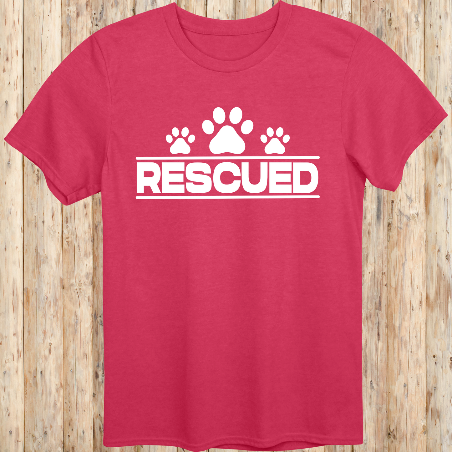 Heather red unisex t-shirt with text that reads 'Rescued', ideal for rescue dog adopters and animal welfare supporters