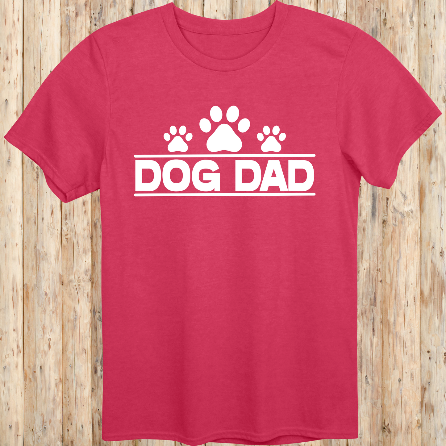 Heather red unisex t-shirt with bold text that says 'Dog Dad', perfect for fathers, pet owners, and dog lovers