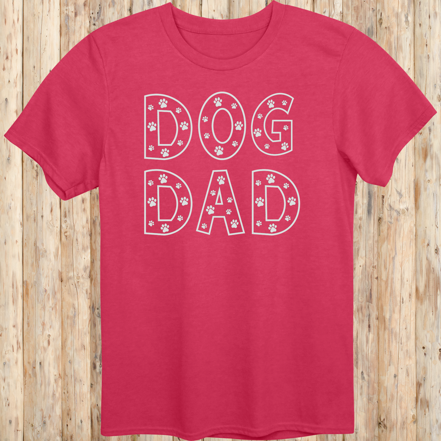 Heather red unisex t-shirt with the words 'Dog Dad' in white text and small paw print accents, perfect for dog dads and pet owners