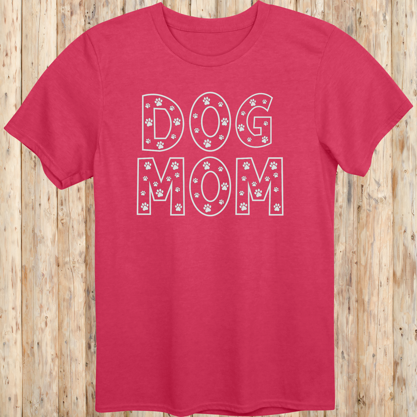 Heather red unisex t-shirt with the words 'Dog Mom' in white text and small paw print accents, ideal for pet moms and dog lovers