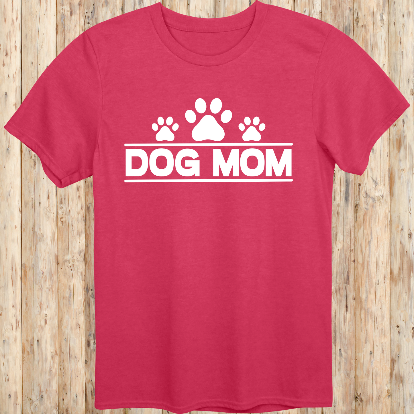 Heather red unisex t-shirt with bold text that reads 'Dog Mom', ideal for pet parents, dog lovers, and animal rescue supporters