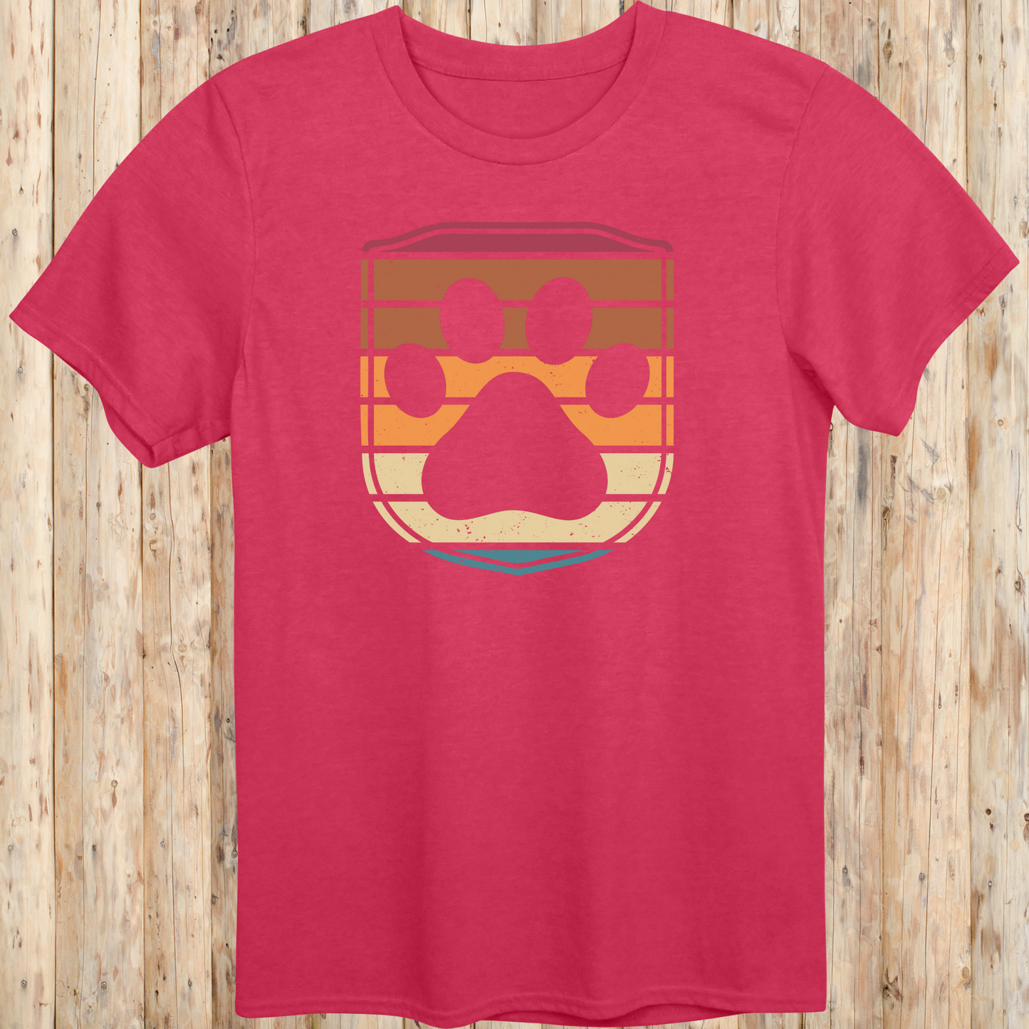 Unisex heather red t-shirt featuring a retro-style dog paw print inside a colorful shield graphic, designed for dog lovers
