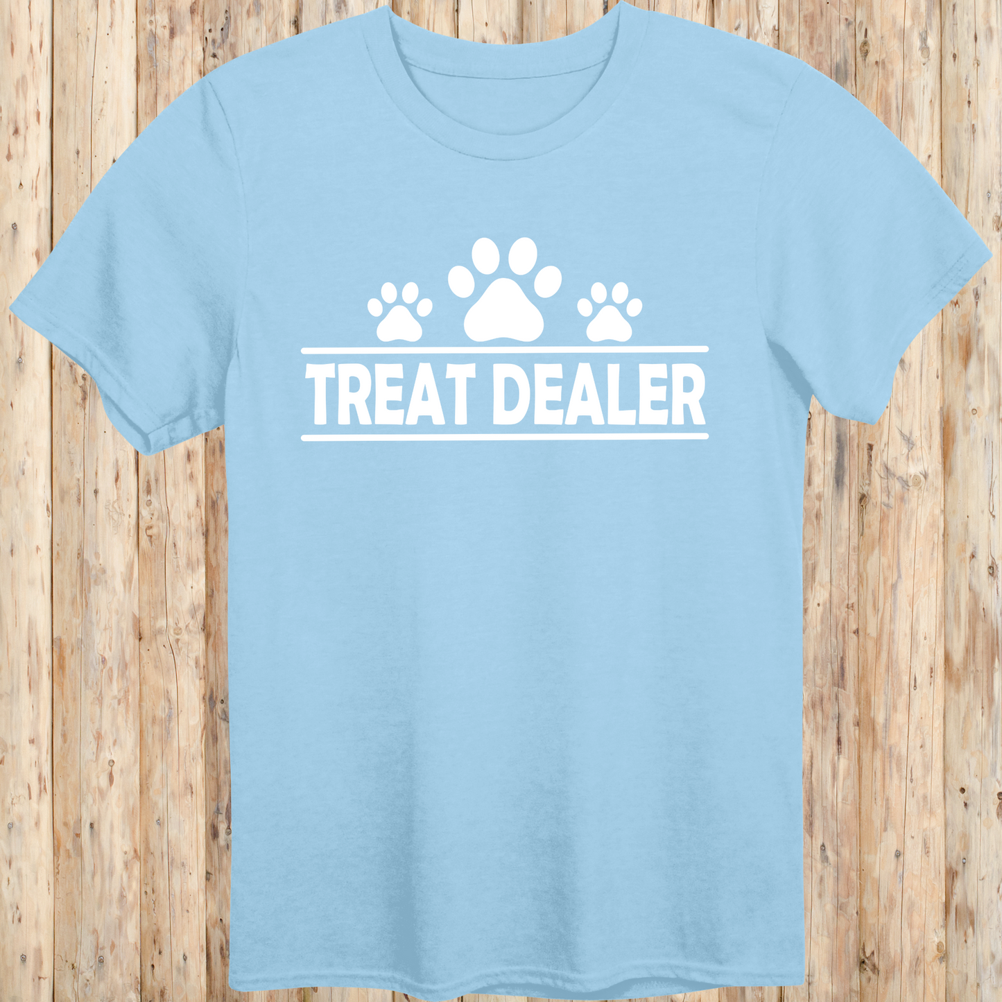 Light blue unisex t-shirt with text that reads 'Treat Dealer', perfect for dog lovers, trainers, and pet parents who spoil their pups