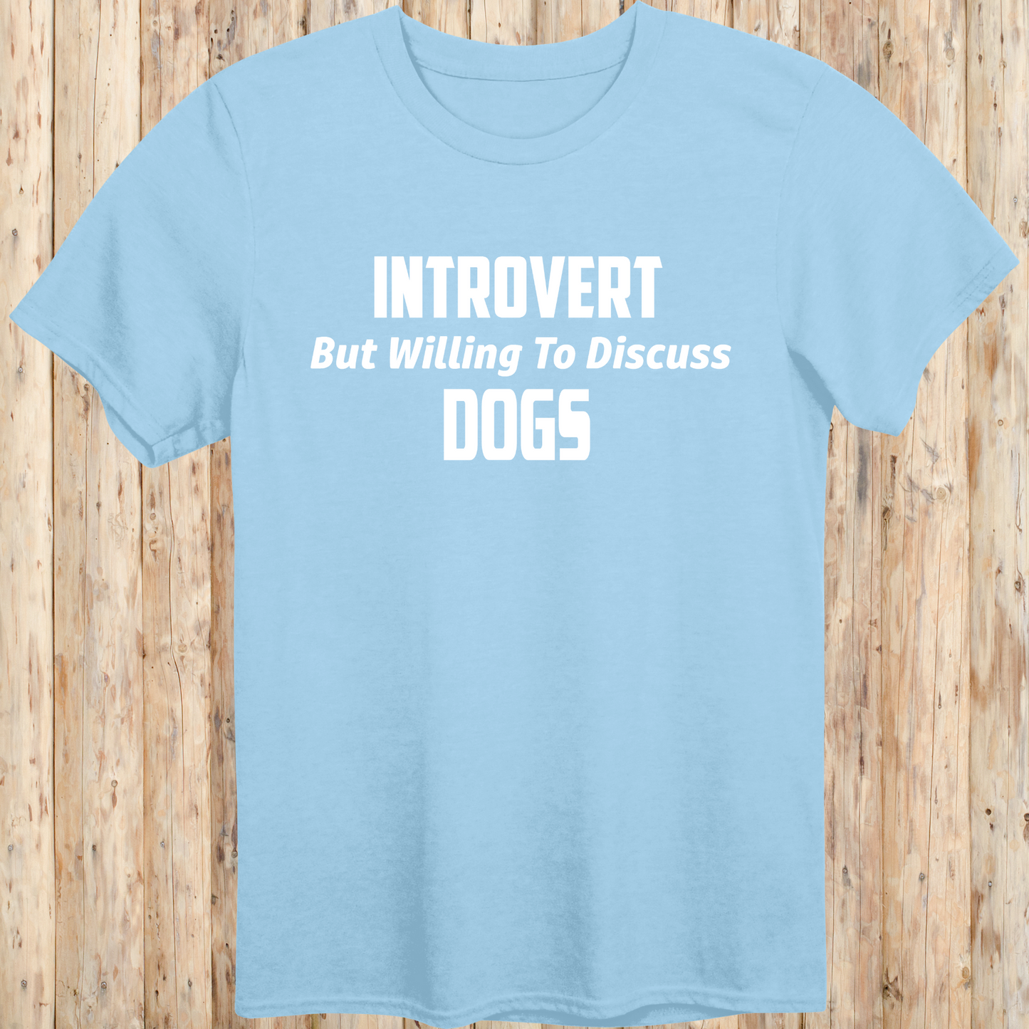light blue unisex t-shirt with white text that reads 'Introvert But Willing to Discuss Dogs', 