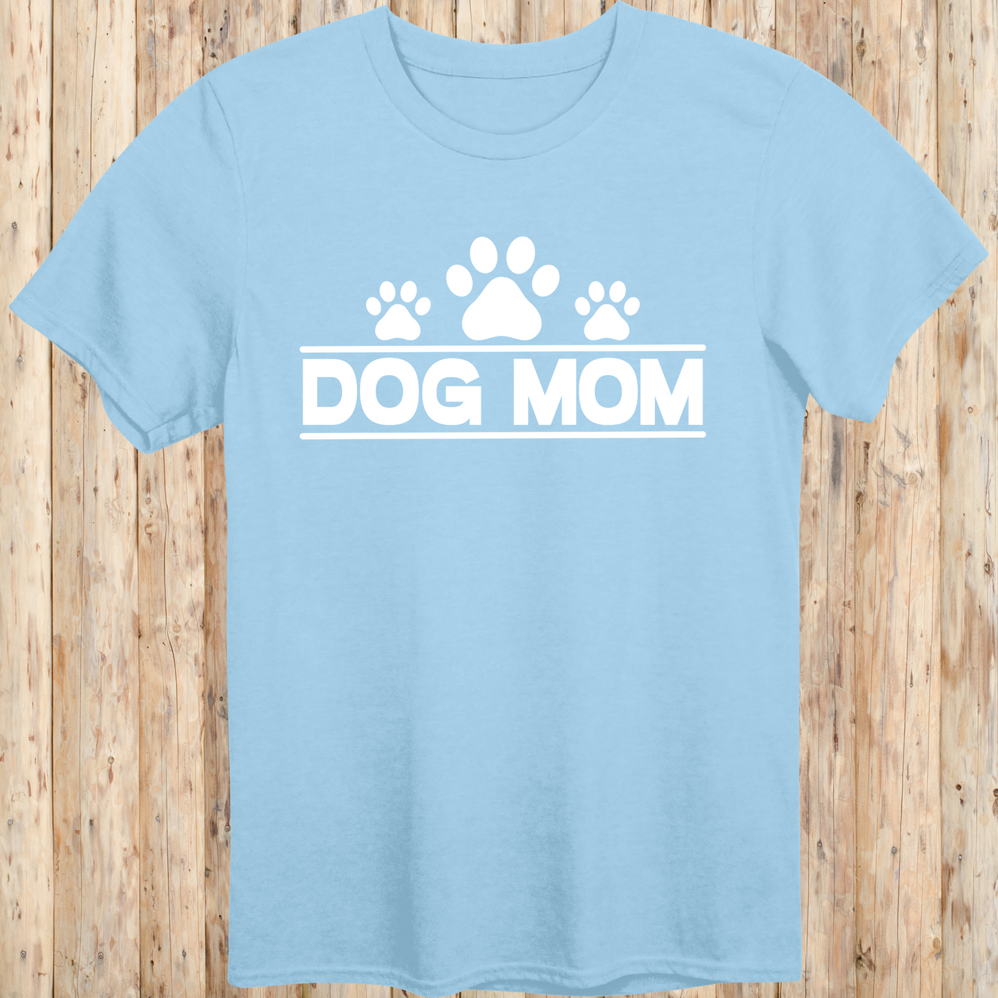 Light blue unisex t-shirt with bold text that reads 'Dog Mom', ideal for pet parents, dog lovers, and animal rescue supporters