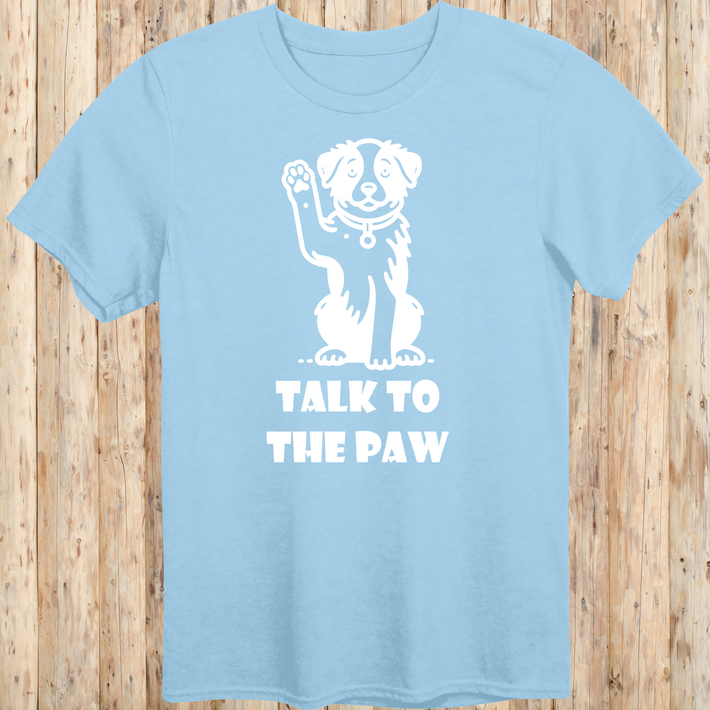 Light blue unisex t-shirt with text that says 'Talk to the Paw', ideal for dog lovers and pet parents with a fun, sassy style