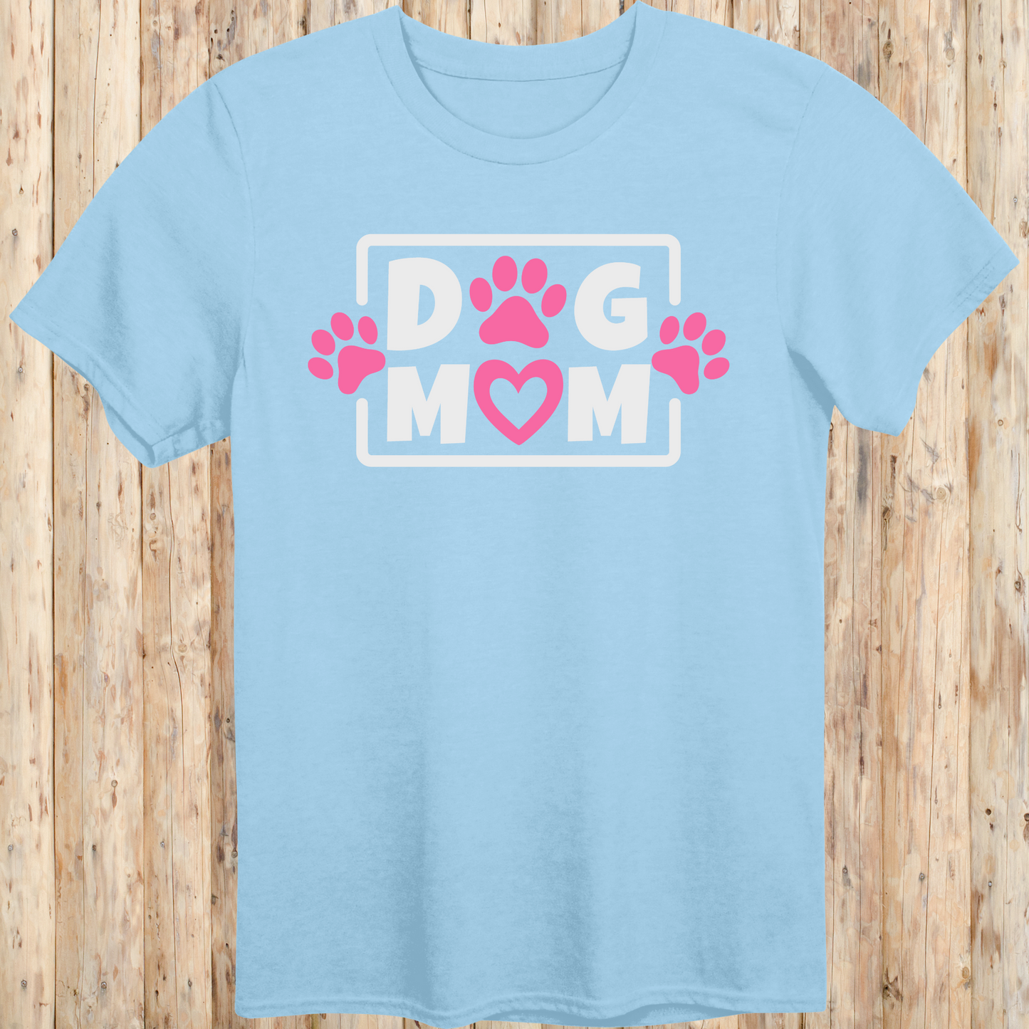 Light blue unisex t-shirt with bold text that says 'Dog Mom', ideal for pet moms, dog lovers, and rescue advocates