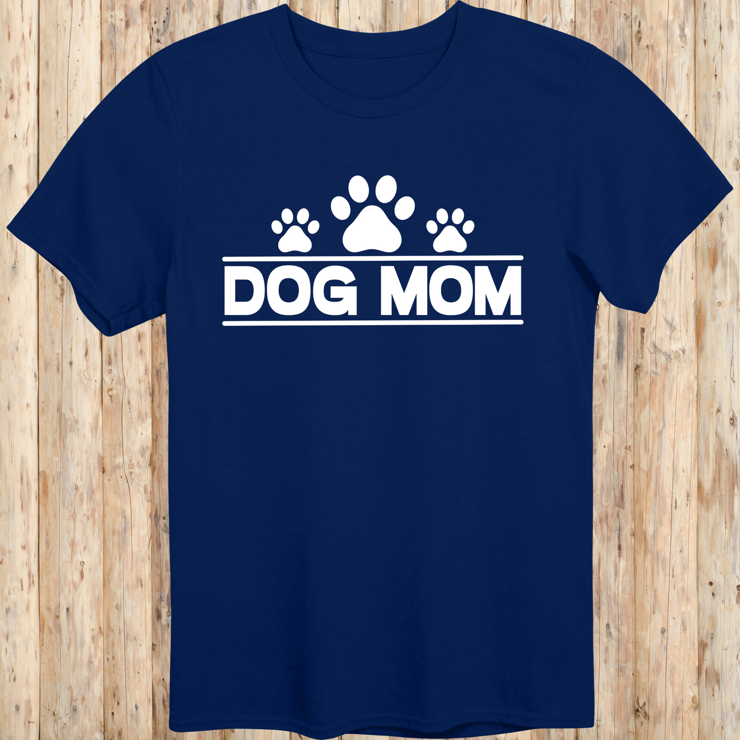 Navy blue unisex t-shirt with bold text that reads 'Dog Mom', ideal for pet parents, dog lovers, and animal rescue supporters
