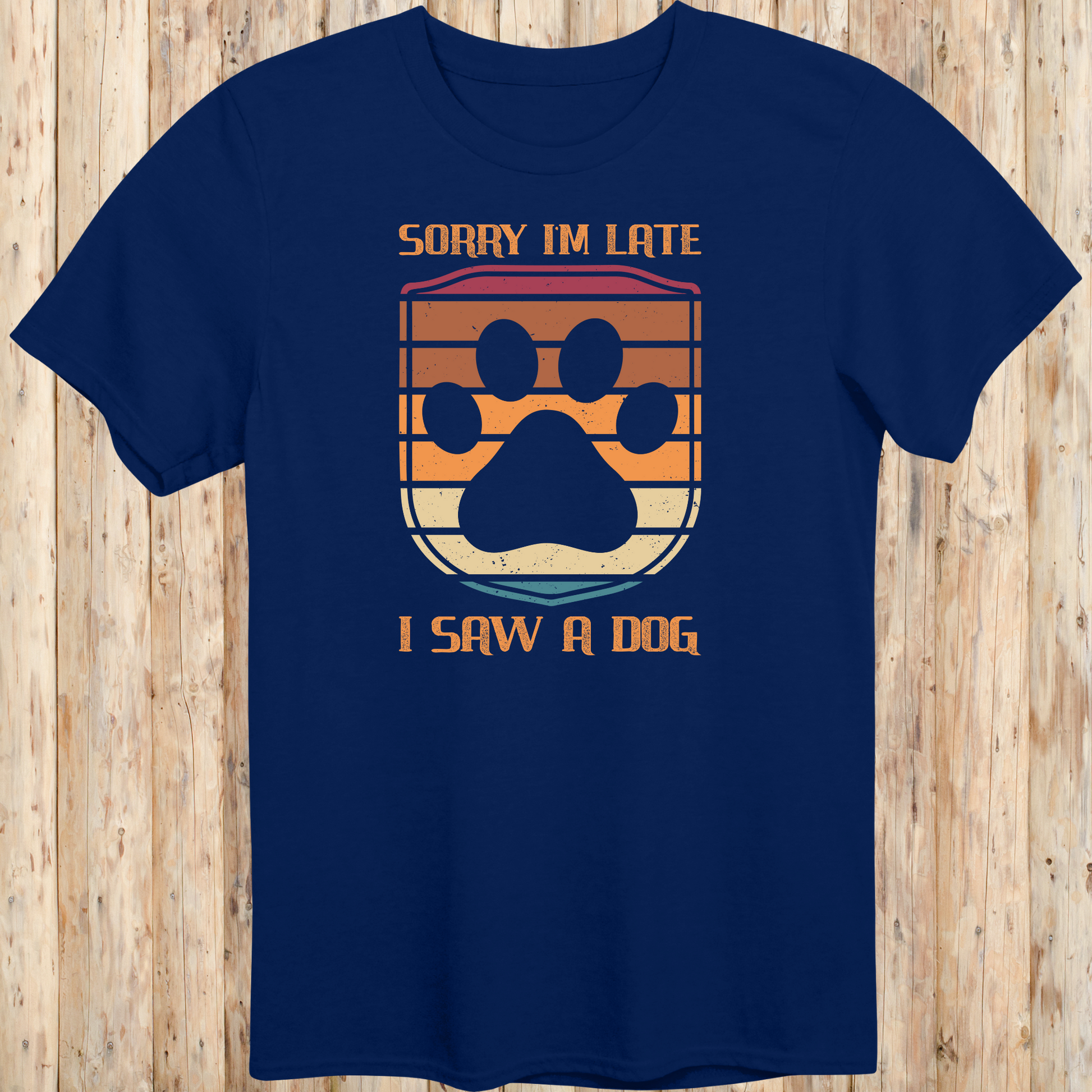 Navy blue unisex t-shirt with retro-colored paw print shield and the phrase 'Sorry I’m Late, I Saw a Dog', perfect for dog lovers