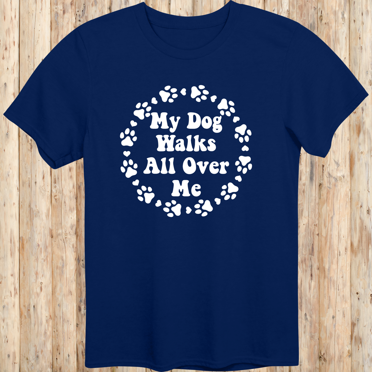 unisex navy blue t-shirt for dog lovers says my dog walks all over me paw prints circle