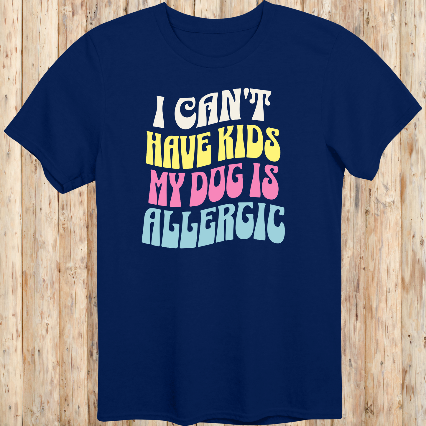 Navy blue unisex t-shirt with white text that says 'I Can’t Have Kids, My Dog Is Allergic', designed for dog lovers with a funny side