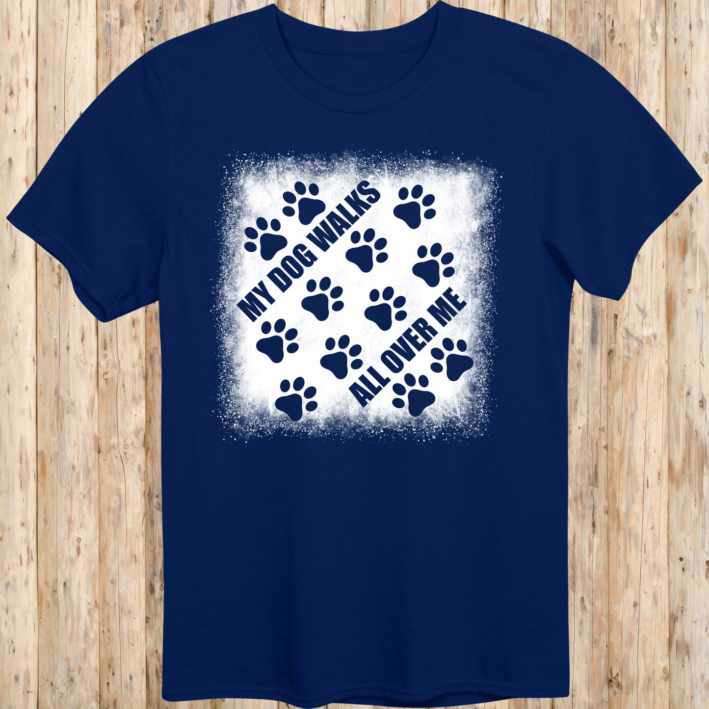 Navy blue unisex t-shirt with paw prints and the phrase 'My Dog Walks All Over Me' printed on the front for men women adults and humans.