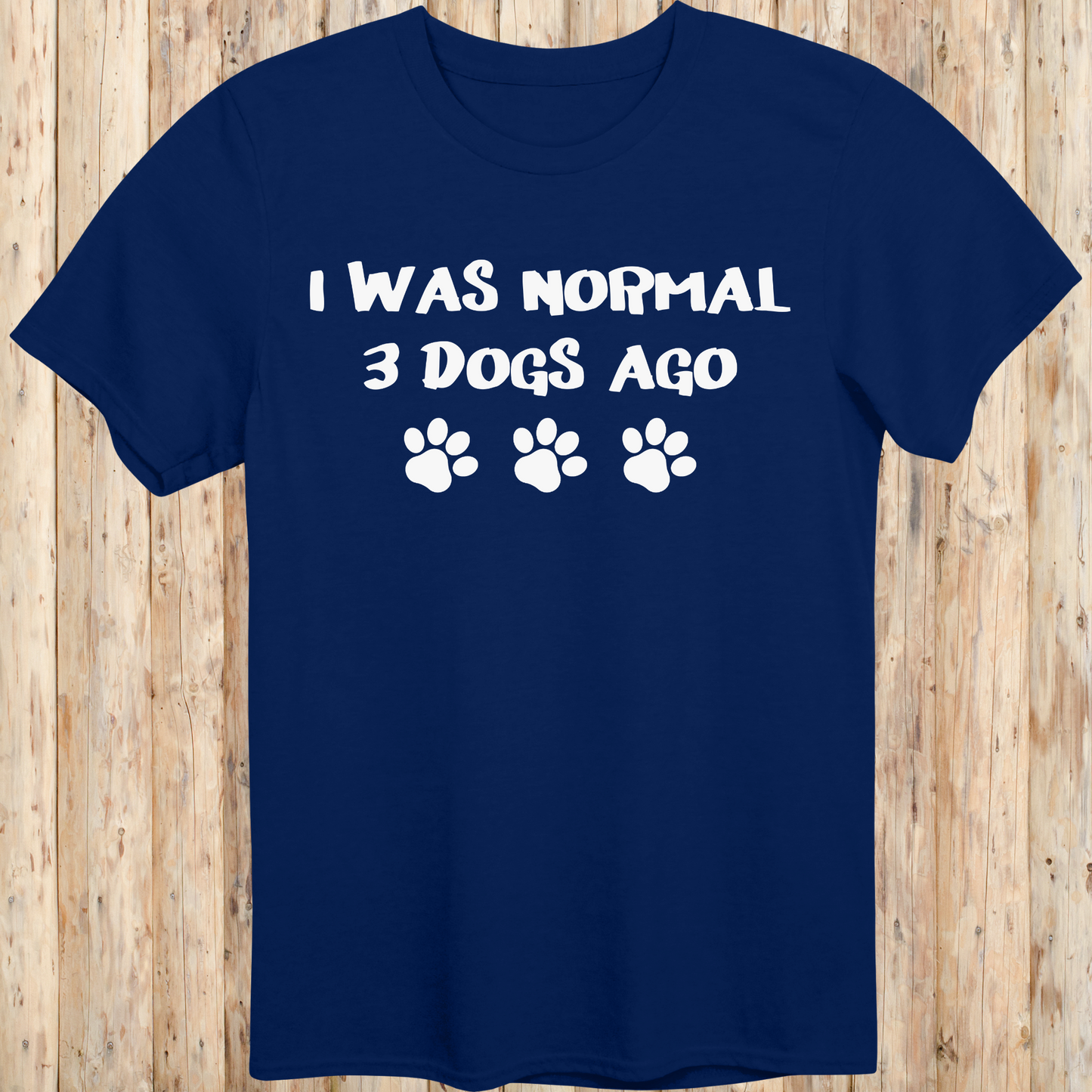 Navy blue unisex t-shirt with text that says 'I Was Normal 3 Dogs Ago', ideal for dog lovers and multiple pet owners