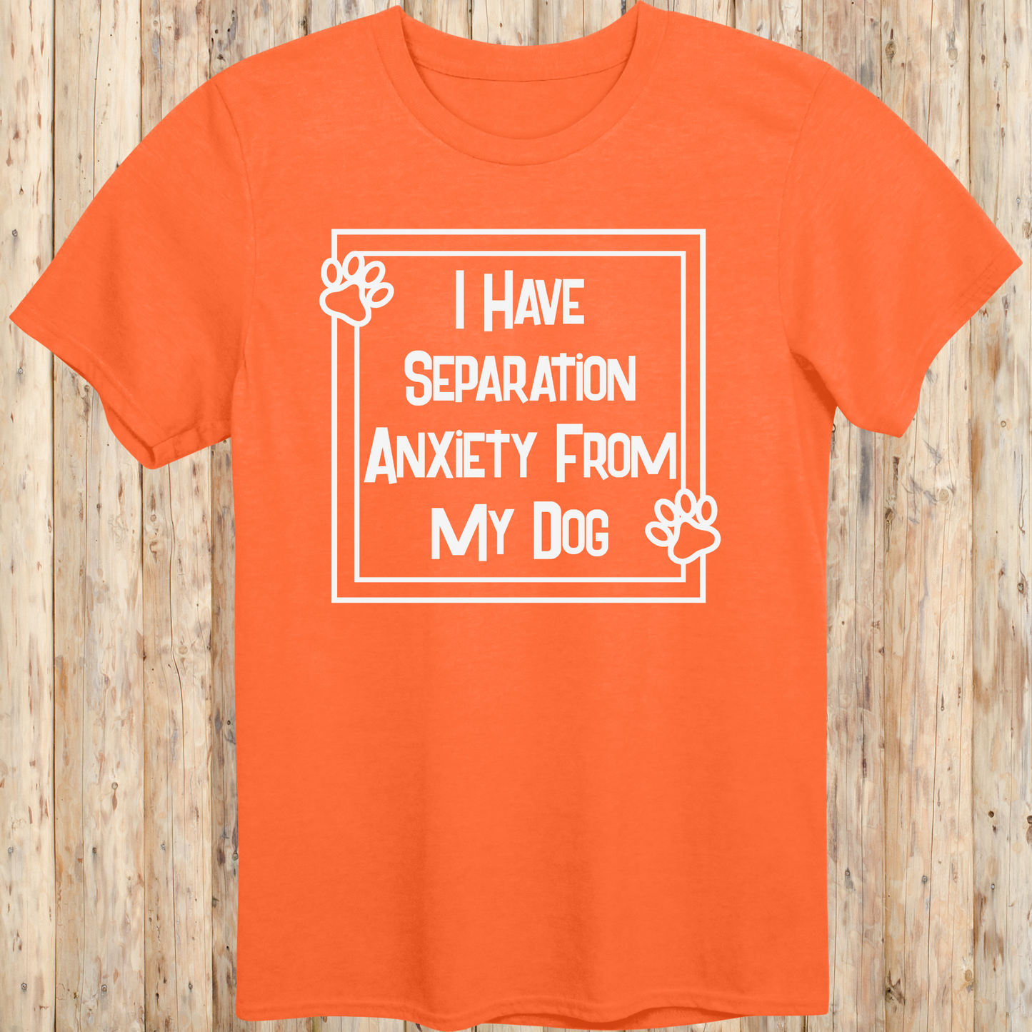 Orange unisex t-shirt with text that says 'I Have Separation Anxiety From My Dog', perfect for devoted dog owners and pet parents
