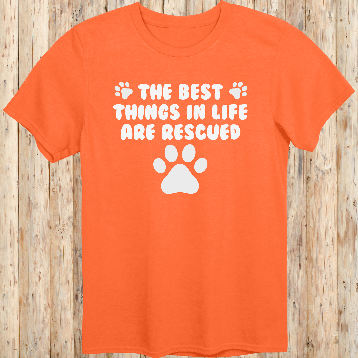 Orange unisex t-shirt with text that reads 'The Best Things in Life Are Rescued', ideal for rescue dog owners and pet adopters