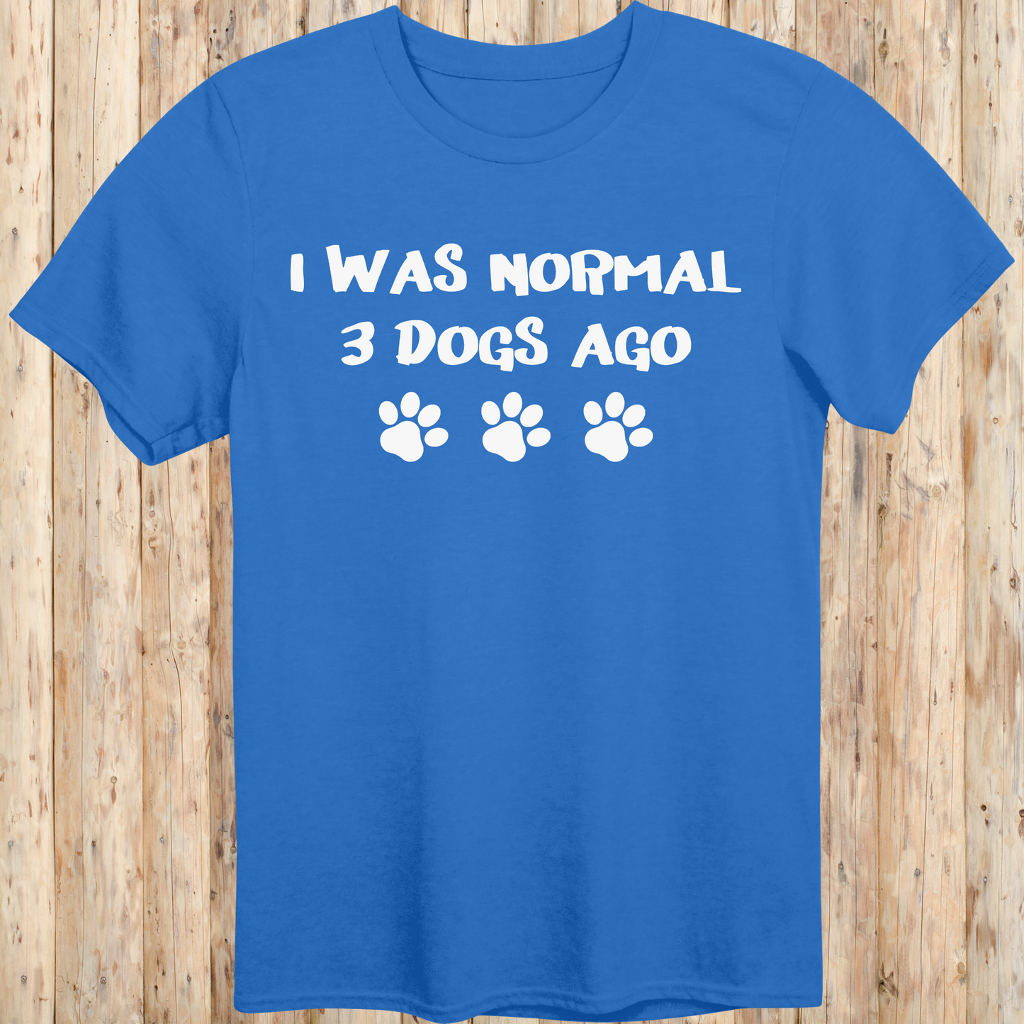 Royal blue unisex t-shirt with text that says 'I Was Normal 3 Dogs Ago', ideal for dog lovers and multiple pet owners