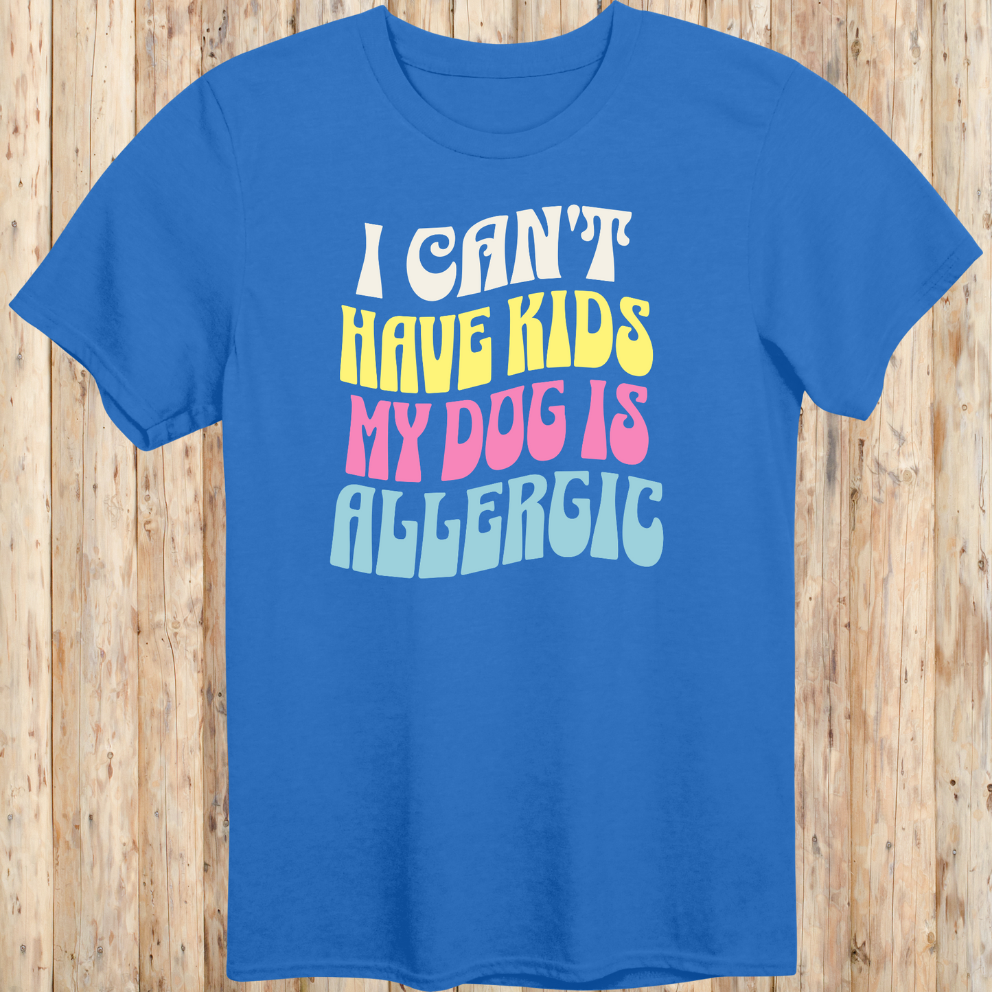 Royal blue unisex t-shirt with white text that says 'I Can’t Have Kids, My Dog Is Allergic', designed for dog lovers with a funny side
