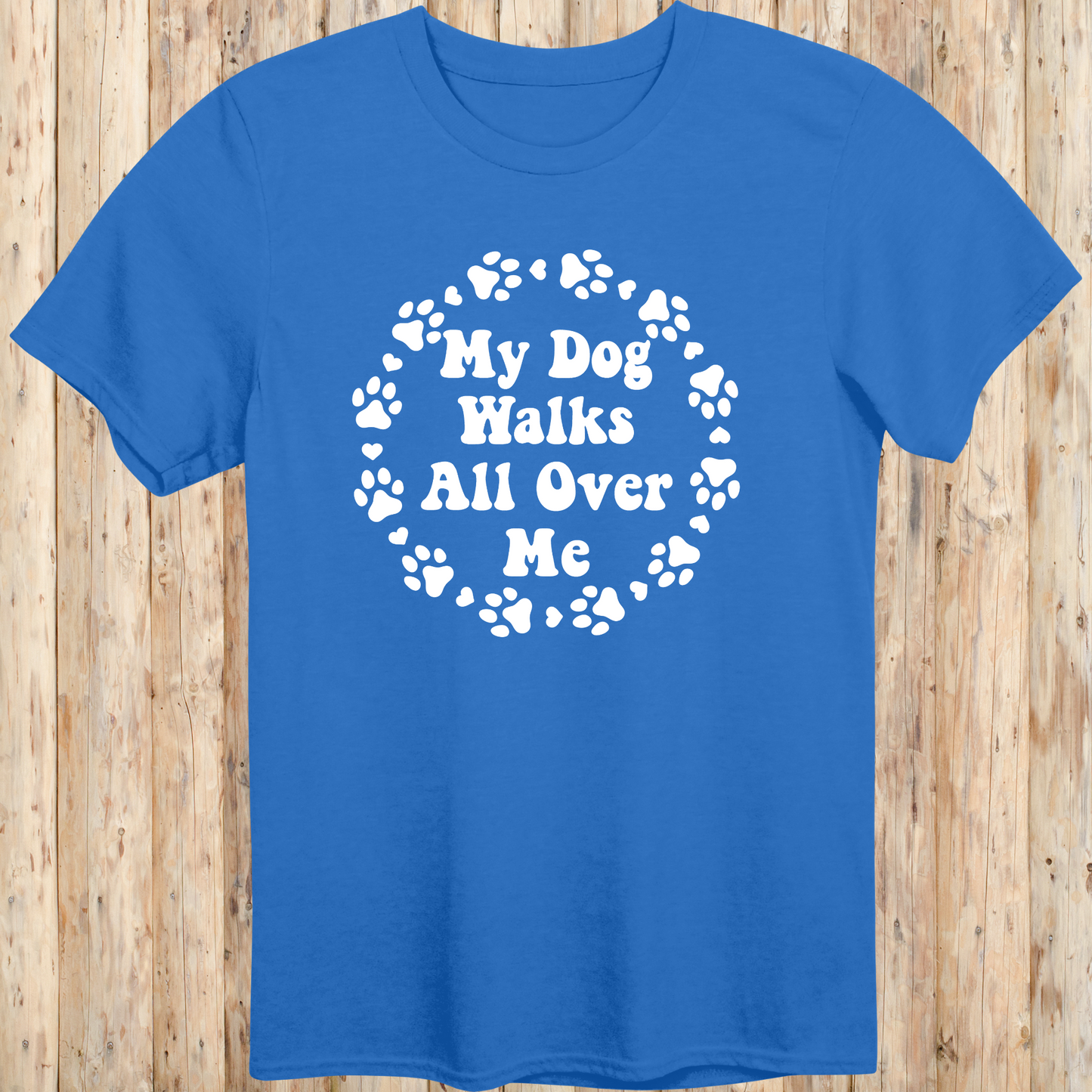 unisex royal blue t-shirt for dog lovers says my dog walks all over me paw prints circle