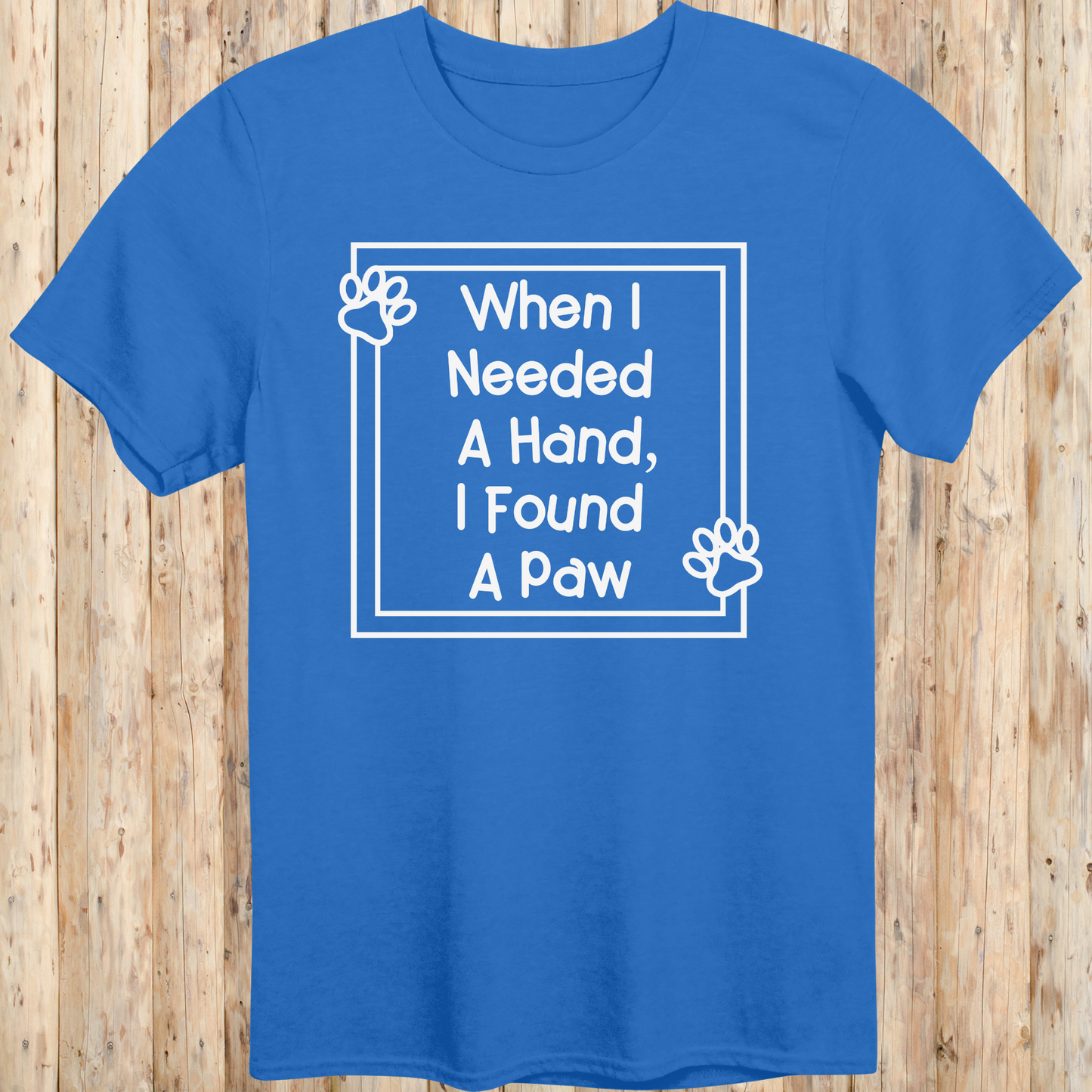 Royal blue unisex t-shirt with text that reads 'When I Needed a Hand I Found a Paw', ideal for dog lovers and rescue pet adopters