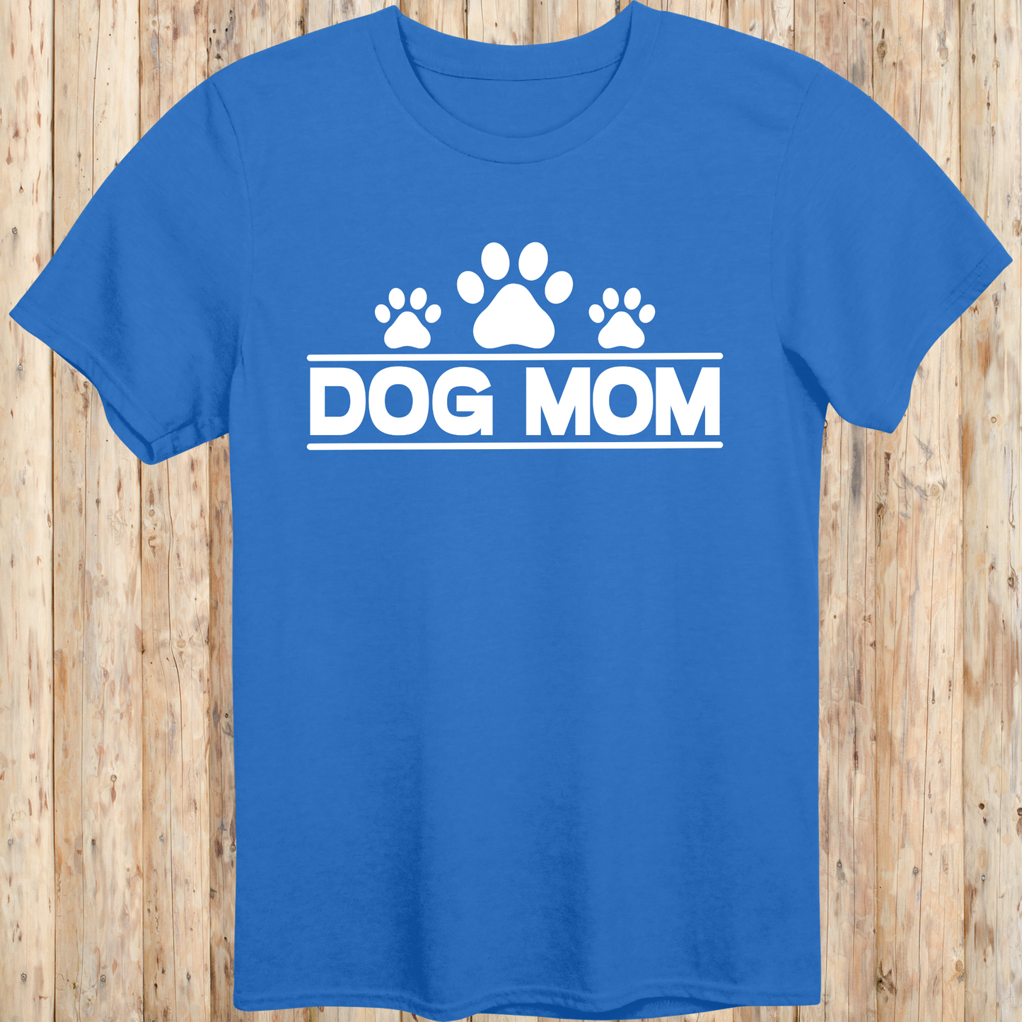 Royal blue unisex t-shirt with bold text that reads 'Dog Mom', ideal for pet parents, dog lovers, and animal rescue supporters